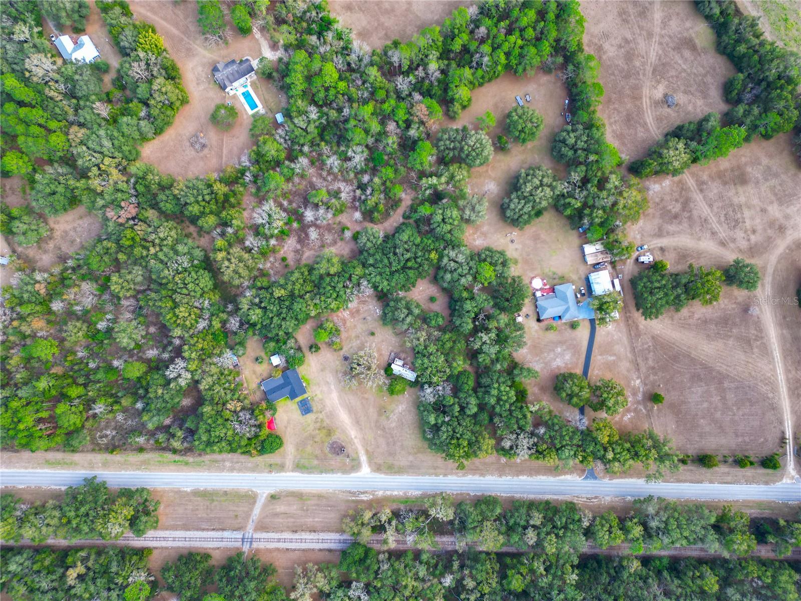 “New Improved Terms - Private 5.27 Acres Near Gainesville – Utilities Installed and In-Place – New Build Site to Create Your Dream Home with Renovation or Replacement Opportunity”

Rare opportunity to own 5.27 beautiful, cleared, and usable acres in Alachua County with electricity, a brand-new well, and septic already installed—a major time and cost savings for buyers looking to build or renovate. Property offers a beautiful mix of cleared land and natural woodland – offering both privacy and character that only time can create in a peaceful rural setting with privacy, yet convenient to Gainesville, High Springs, and surrounding areas.

The property includes an existing 2 bedroom / 2 bathroom mobile home that is in need of repair and is being sold as-is, making this an ideal handyman special, rental renovation, investment opportunity, or ideal site for a new manufactured home or to build your dream home; ready for your vision. Additional features include a fenced dog run, two storage sheds, and ample space for outdoor living. Seller has priced property with flexibility for renovation or replacement combined with credit value incentives at closing.  

Buyer may renovate existing home, remove, replace, or build new using existing well, septic, and power infrastructure already in place.

· Utilities already installed (significant buyer savings and headaches)
· NO HOA
· Renovation or removal credit at closing
· Seller is offering a credit for closing costs. Listing agent has details.

Distance to:

· Jonesville 15 minutes away

o Tioga Town Center, restaurants, shopping, Publix, social activities, events and venues, water parks, golf, and public parks.

· High Springs 20 minutes away

o Numerous crystal-clear natural springs with 72-degree water year-round, swimming, snorkeling, diving, tubing, kayaking, canoeing, paddle boarding, hiking caves, and camping along Sante Fe River.

· Alachua City 25 minutes away

o Mills Creek Farm for retired horses, Manatee Monkey and Wildlife Adventure, recreational activities for families including a splash pad, skate park, recreation complex, crystal clear natural spring with 72-degree water year-round, swimming, snorkeling, kayaking, paddle boarding, and manatee encounters

· Gainesville 25 minutes away

o Oaks Mall, University of Florida, restaurants, social activities, events and venues, public parks, golf, wildlife conservation foundation, museum of natural history, botanical garden, geological state park, museum of art, walking trails and parks.