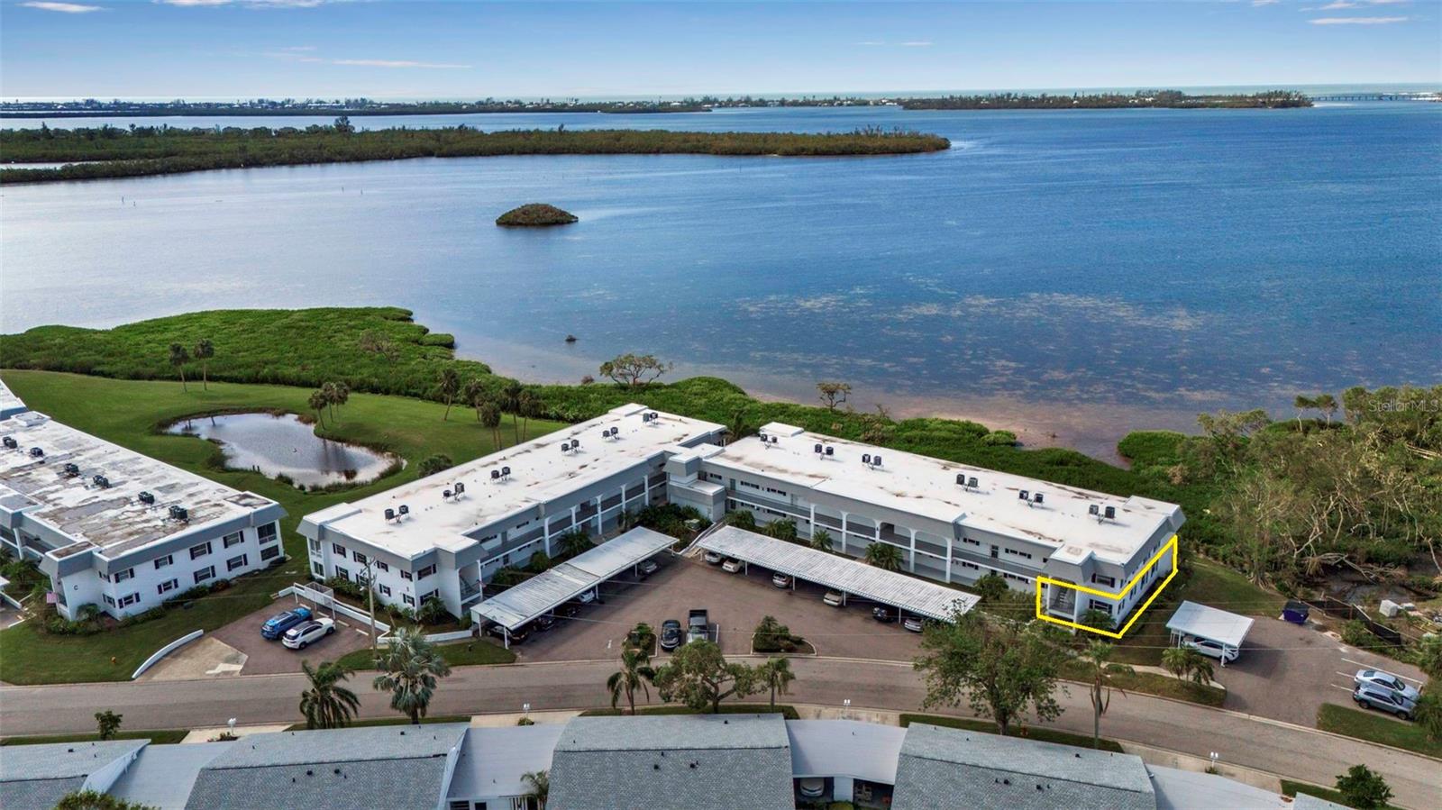 Motivated Seller.....Owner says "Bring an Offer!"  Welcome to paradise in the highly sought-after Mount Vernon community with open, million dollar bay views and gorgeous sunsets!  Amazing price for this immaculate 2-bedroom, 2bath ground floor end unit with a carport offers the perfect blend of comfort, convenience and coastal charm.  It is a rare opportunity for a bayfront, ground floor end unit to come on to the market and this one is in pristine move-in ready condition and is being sold turnkey furnished. From the moment you enter you will fall in love with the light filled open living and dining areas, beautiful decor, peaceful setting and expansive water views all the way out to the Longboat Key bridge and gulf. This condo is ready for you to enjoy the effortless Florida living in this well maintained and active 55+plus community known for it's spectacular waterfront and park like setting. Residents of Mount Vernon enjoy an active, resort-style lifestyle featuring a clubhouse, heated swimming pool, tennis and pickleball courts, bocce ball, shuffleboard, fitness center, walking and biking trails, a kayak launch and storage, a bayfront covered pavilion with grills, and a boat ramp providing access to the bay and individual boat slips with boat or RV storage with only a $25 one-time fee (when available, may be a waiting list). The community also offers workshop and hobby rooms along with a variety of social clubs and activities, creating a vibrant and welcoming atmosphere. Mount Vernon also offers an outstanding proximity to the region’s most desirable destinations including Anna Maria Island, Longboat Key and downtown Sarasota, making it easy to enjoy Sarasota’s cultural scene and the areas Gulf Coast beaches. Flood insurance is not required by the association and not included in the fees but the Seller does have a transferable flood policy that could be transfered at closing.  Whether you're looking for a full time residence or seasonal retreat this condo checks every box! Buyer can enjoy extra peace of mind with a Seller paid American Home Shield Shield Complete One Year Home Warranty too! Schedule your private showing before this gem is gone!