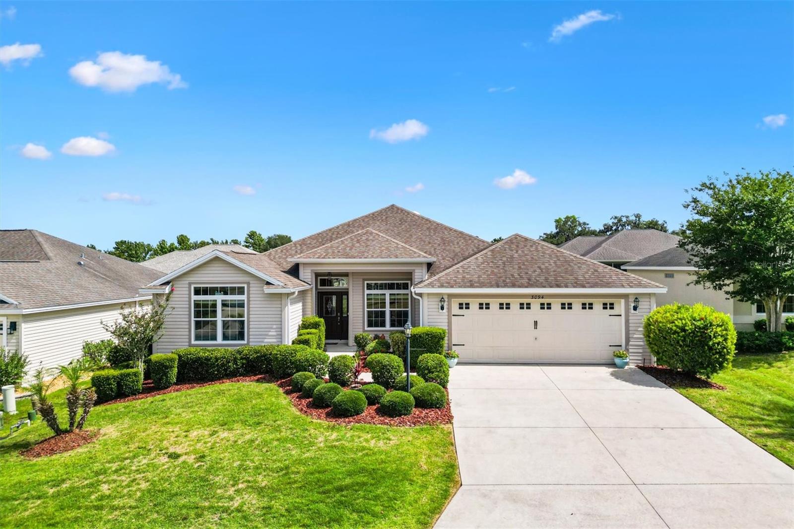 Welcome to your dream home nestled in the warm and inviting community of Oxford Oaks. This home offers the perfect blend of tranquility and convenience! Just minutes from The Villages, FL, this ideal location gives you easy access to schools, shopping, and dining - making it a perfect place to call home for families of all ages! One of the highlights of this community is the array of amenities offered for residents, including a resort style pool, playground, tennis, pickleball & basketball courts. This well-maintained home boasts a spacious open floor plan layout, featuring 3 bedrooms & 2 Bathrooms. Enjoy your morning coffee on the front porch or retreat to the spacious lanai overlooking a fully fenced in back yard!  Inside the home, you’ll find a spacious kitchen featuring stainless steel appliances, abundant cabinetry, and generous counter space — perfect for both everyday living and entertaining. The home’s thoughtfully designed layout is enhanced by 10-foot ceilings throughout the main living areas and vaulted ceilings in both guest bedrooms, creating an open, airy atmosphere that makes the home feel even more spacious.
The master suite offers an elegant tray ceiling and a luxurious en suite bathroom complete with dual vanities, a large walk-in shower, and separate his-and-hers walk-in closets.
Storage is plentiful throughout the home, including a spacious two-car garage. For added convenience and efficiency, the current owner has installed a separate irrigation water meter.
Don’t miss the opportunity to make this exceptional property your own. Schedule your private showing today and begin the next chapter of luxury living in Oxford Oaks.