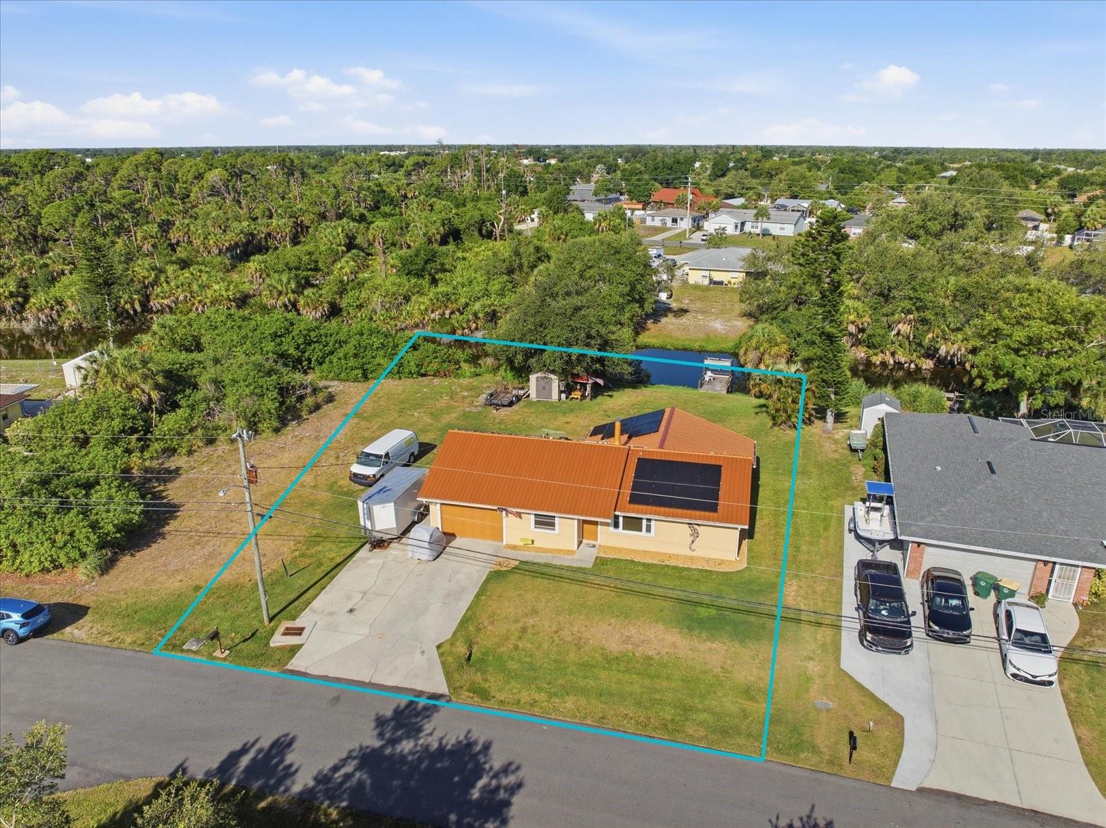 Welcome to your dream waterfront oasis! This beautifully updated 3-bedroom, 2-bathroom home features a spacious garage, separate living and family rooms, and a dedicated laundry room. The heart of the home boasts a cozy fireplace, perfect for relaxing evenings. Step outside onto your large, quarter-acre lot to experience true Florida living, complete with a  private dock ideal for fishing right from your backyard. Enjoy maximum sunshine all day long thanks to the highly desirable southern rear exposure. With a brand-new roof and extensive updates throughout, this canal-front gem is completely move-in ready. Situated in a quiet, established neighborhood with no HOA or CDD fees, you are just minutes away from shopping, dining, and Gulf beaches!
