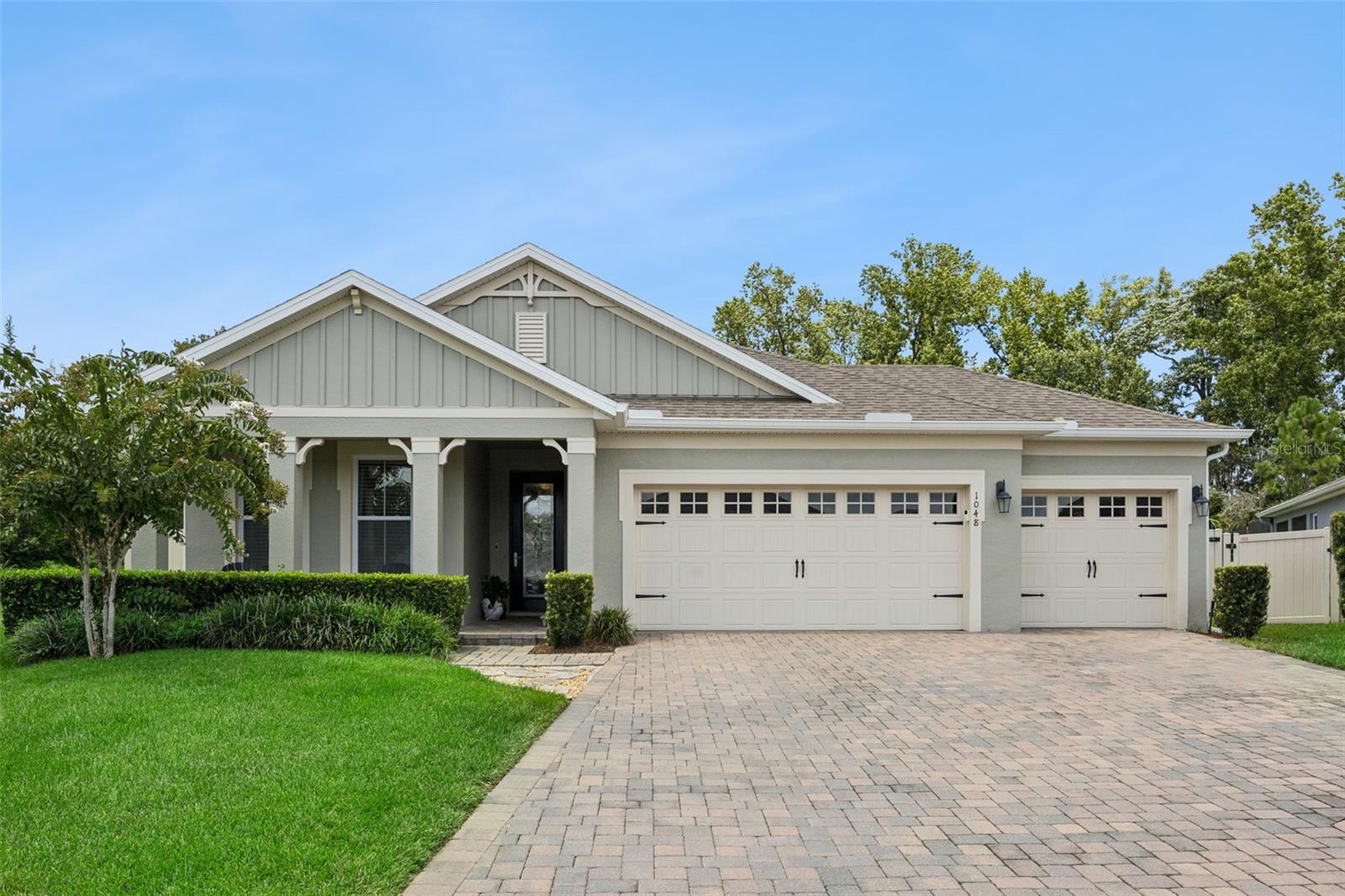 Welcome to Parkdale, one of Oviedo's most desirable gated communities! Built in 2019, this beautifully maintained 4-bedroom, 3-bath home sits on a fully fenced, oversized one-third-acre lot with no rear neighbors and breathtaking conservation views. If you've been searching for privacy, modern finishes, and a move-in-ready home, this one checks all the boxes. Inside, you'll find a highly desirable three-way split floor plan that offers both privacy and functionality, while the open-concept kitchen, family room, and dining area create the perfect space for everyday living and entertaining. The kitchen features a natural gas cooktop, electric wall oven, abundant cabinetry, and generous counter space. The spacious owner's suite is a true retreat with a tray ceiling, dual vanities, a garden tub, separate shower, and a huge walk-in closet complete with custom built-in cabinetry. The secondary bedrooms are thoughtfully positioned with access to their own bathrooms, providing comfort and privacy for family members and guests. This move-in-ready home has been beautifully upgraded with a custom pantry, custom primary closet organization, upgraded laundry room cabinetry, an epoxy-coated garage floor, an upgraded front door, a remodeled guest bathroom with a new shower, and fresh interior and exterior paint completed within the last year. Additional features include a natural gas tankless water heater and one of the few neighborhoods in Oviedo offering natural gas service. Step outside to your private, fully fenced backyard and enjoy the peace and quiet of no rear neighbors with stunning conservation views. Whether you're enjoying your morning coffee, hosting family and friends, or simply unwinding after a long day, this backyard is designed to be enjoyed year-round. Minutes from everything Oviedo has to offer, Parkdale is conveniently located off SR 426 with easy access to SR 417, making for an easy commute to Orlando. You'll also be close to Oviedo on the Park, shopping, restaurants, entertainment, and everyday conveniences.