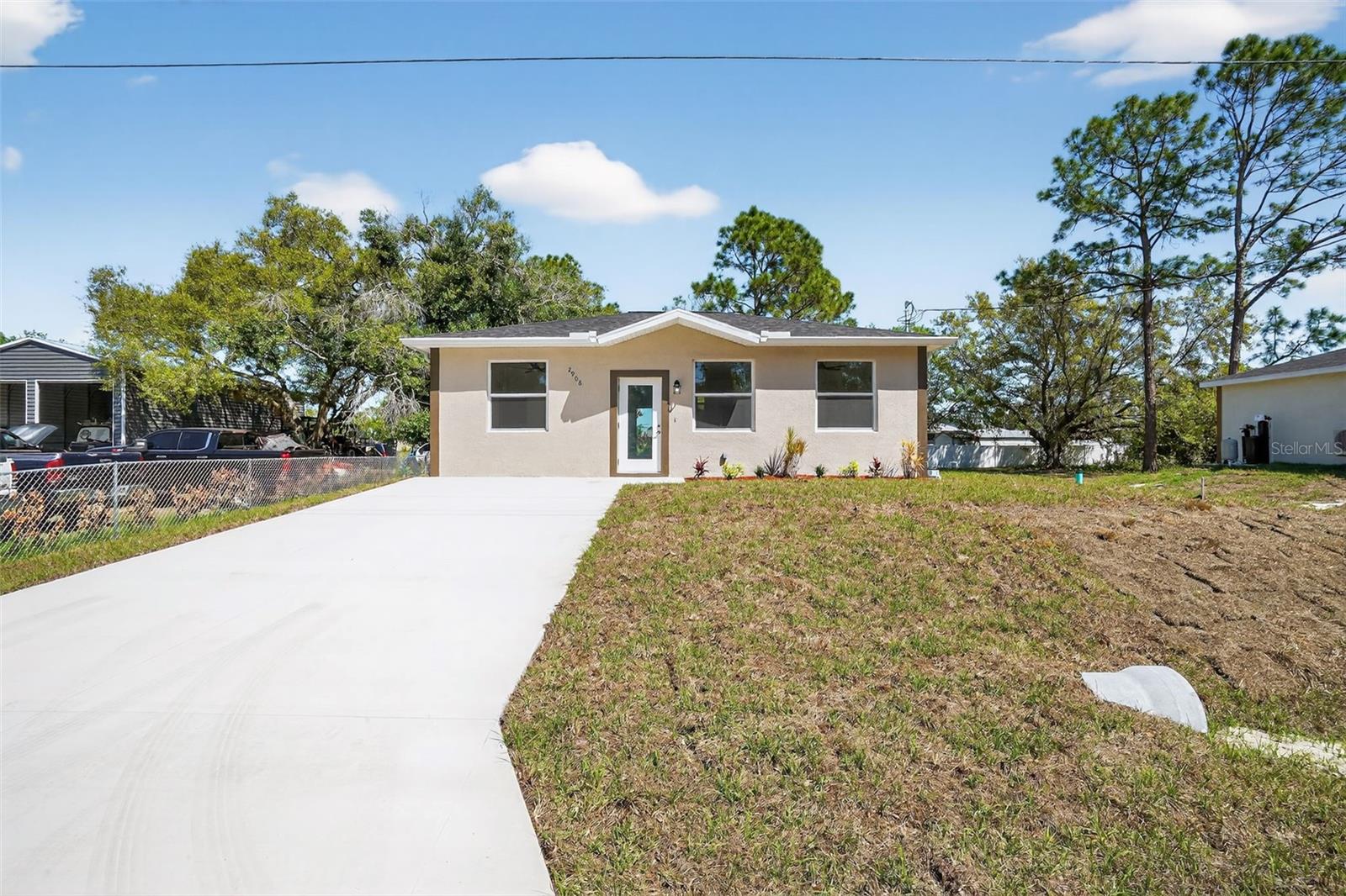 Welcome to your brand-new home in the growing community of Lehigh Acres! This charming 2-bedroom, 2-bathroom residence offers approximately 1,000 square feet of thoughtfully designed living space, perfect for first-time buyers, downsizers, or investors.

Situated on a desirable west-facing lot, the home enjoys warm afternoon sunlight in the front and soft morning light in the backyard—ideal for relaxing mornings or future outdoor enhancements. Inside, you’ll find a functional open layout with comfortable living and dining areas, a modern kitchen, and well-sized bedrooms designed for everyday living.

Located on a quiet street with ongoing new construction, this property offers a peaceful setting while still being conveniently close to shopping, dining, schools, and major roadways. With no HOA restrictions, you’ll have the freedom to truly make this home your own.

Whether you’re looking for a primary residence, seasonal retreat, or investment opportunity, this move-in-ready home is a fantastic find in one of Southwest Florida’s fastest-growing areas.

Don’t miss your chance to own a piece of paradise in Lehigh Acres!