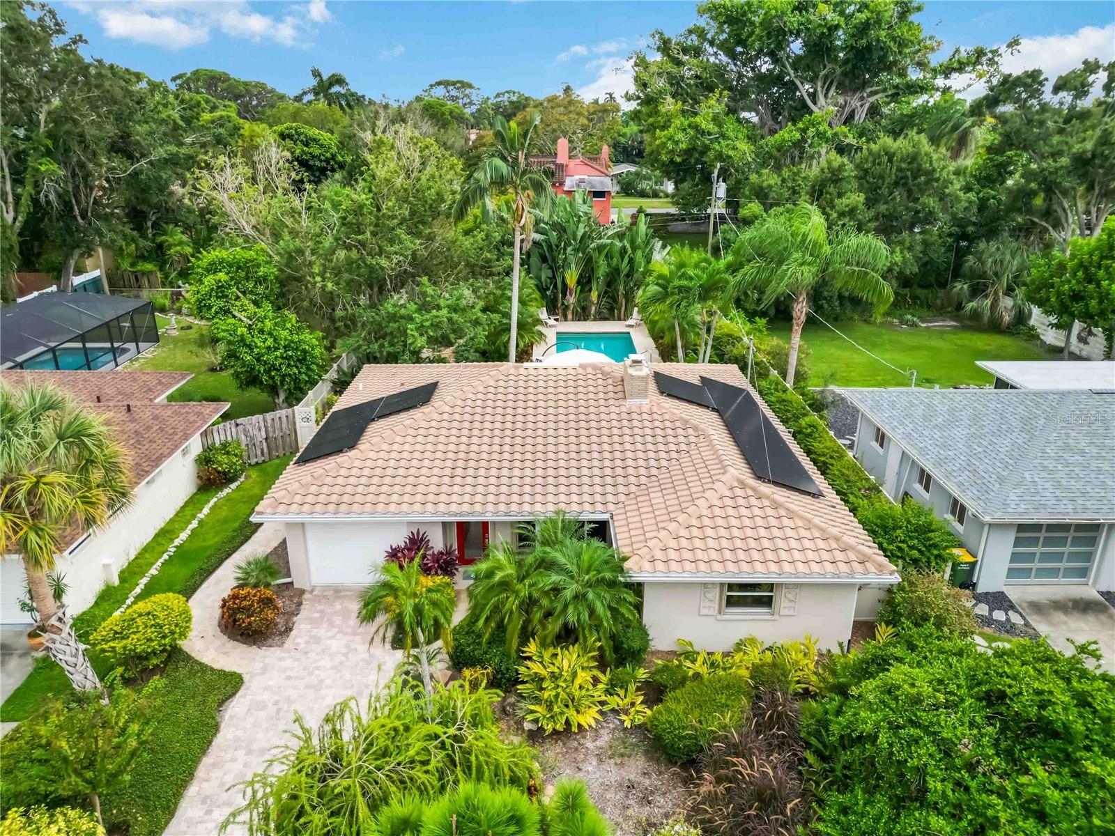 **MASSIVE $100K PRICE REDUCTION ~ SELLER SAYS SELL **
 Classic Old-Florida Oasis in Sarasota’s Museum District ~ Welcome to 442 N Shore Drive, a timeless Old-Florida residence located in the prestigious Ringling Museum / Sapphire Shores neighborhood, where majestic oak canopies, Spanish moss, and historic architecture set the stage for Sarasota’s most enchanting lifestyle. From the moment you arrive, you’ll be captivated by the home’s mature, meticulously maintained landscaping that frames the property with lush greenery and vibrant tropical plantings, all sprinkler fed from the well! The front yard offers a warm welcome, while the private backyard reveals your own resort-style escape.  Inside, this 3-bedroom, 2-bath home (~1,664 sq. ft.) combines vintage charm with modern updates. A wide-open great room flows into the designer kitchen with stone countertops, solid wood cabinetry, and stainless appliances. Tile floors and dual vanities enhance the comfort and functionality.  At the rear of the home, a sunroom overlooking the pool invites you to relax, read, or watch the Florida weather shift from golden sunshine to refreshing summer rain. Step outside and discover a tropical paradise: a sparkling pool surrounded by swaying palms, flowering shrubs, and a fully fenced yard designed for privacy and serenity. A hidden storage shed blends seamlessly into the landscape, adding convenience without sacrificing the oasis-like feel.  Set among multimillion-dollar waterfront estates and historic Mediterranean gems, this home is priced aggressively to sell!  All just minutes from The Ringling, Asolo Rep, Ringling College, downtown Sarasota, SRQ Airport, and the Gulf beaches.  Contact the listing agent today for private VIP tour!