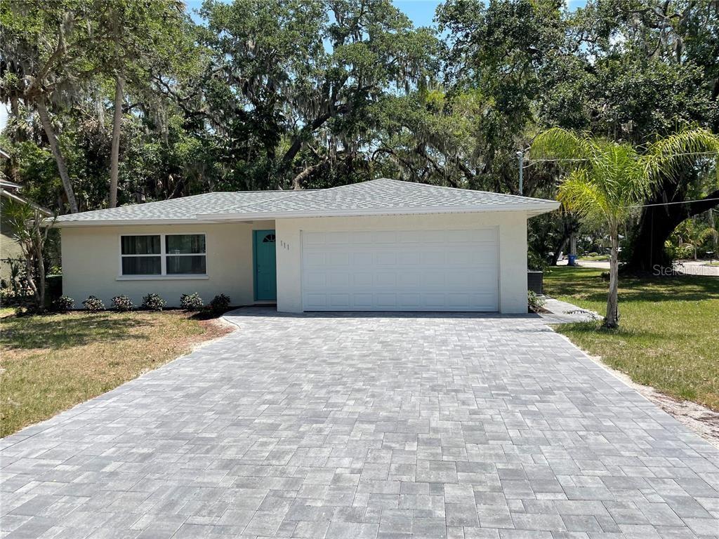 This spacious and beautiful Bradenton home offers 3 bedrooms and 2 bathrooms. Here's your chance to own the perfect family home or starter home. With a large patio and a yard big enough for a pool, this home offers great outdoor living spaces. It is the perfect choice for a first time home buyer or a growing family, as it has been completely renovated and includes upgrades. With solid wood cabinets, granite countertops, stainless steel appliances, custom backsplashes, and designer faucets, the kitchen has been completely renovated. As with the kitchen, the bathroom features new hardware, granite countertops, a custom vanity, and granite countertops in the shower. Among the other upgrades, you will find a NEW ROOF (2022), NEW IMPACT WINDOWS THROUGHOUT (2022), NEW GARAGE DOOR (2022), NEW HVAC (2022), NEW WATER HEATER (2022), new flooring throughout, new paint, new LED light fixtures, and MORE!