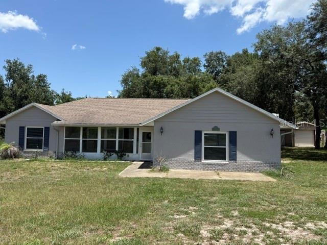 Little Piece of Country Living with NO HOA! Sitting on almost two acres,  Completely Fenced. This Well Maintained Home will not Disappoint! Features include: *4 Bedrooms *2 Baths, Tile Throughout, *interior paint (2019) *Roof 2016 *New Double Pane Windows (2021) *Newly Painted Exterior (2021) *Interior Paint (2019) *Both Bathrooms Updated  *New Drain-field (2018) *20 X 24 Metal Outbuilding w/Electric, pad and RV hookup. Close to New Minneola Turnpike Exit.  Family room (4th bedroom)19 X 19.  Enclosed 4 X 20 Front Porch, Screened back porch.  
County maintained Road. Newer appliances, interior walls insulation is spray foam.
ADDITIONAL PICTURES SOON!!!