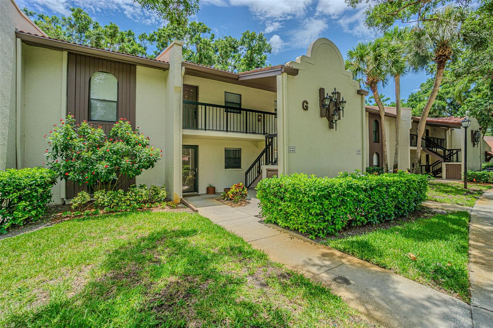 Experience the ease of single-level living in this beautifully updated 2-bedroom, 2-bathroom first-floor condo located along Palm Harbor’s East Lake corridor. Move-in ready and thoughtfully improved, this home features high ceilings, fresh interior paint in 2025, and approximately $65,000 in recent upgrades.

The front entry opens into a bright, open floor plan where the living and dining areas create a comfortable central gathering space. New Pergo flooring, recessed lighting, crown molding, and sliding glass doors leading to the screened lanai give the home a clean, inviting feel with peaceful outdoor views.

The remodeled kitchen blends function and style with white cabinetry, granite countertops, newer stainless steel appliances, Bosch dishwasher, a dedicated wine and beverage fridge, a reverse osmosis system, new tile flooring in 2025 and a breakfast bar ideal for casual dining or entertaining.

The split-bedroom layout offers privacy for both owners and guests. The primary suite includes engineered hardwood flooring, crown molding, a closet system, and a sliding barn door leading to the beautifully remodeled en-suite bath with dual sinks, updated cabinetry, modern fixtures, and a custom shower. The second bedroom is generously sized and works well as a guest room, office, or seasonal retreat, while the second full bath has also been updated with a granite-top vanity and contemporary finishes.

Additional updates and features include Hunter ceiling fans, updated trim, closet systems, assigned covered parking, screened lanai, and a brand-new water heater in 2026. The seller has paid the special assessment for the HOA roof project. The property is located in Flood Zone X, adding another layer of peace of mind.

The monthly condo fee covers cable TV, internet, water, sewer, trash, pest control, exterior maintenance, and access to the community pool. Enjoy convenient access to Tarpon Woods Golf Club, John Chesnut Sr. Park on Lake Tarpon, the North Pinellas YMCA, shopping, dining, beaches, downtown Palm Harbor, Dunedin, and Tampa International Airport. This is a well-updated, low-maintenance Palm Harbor home ready for its next owner.