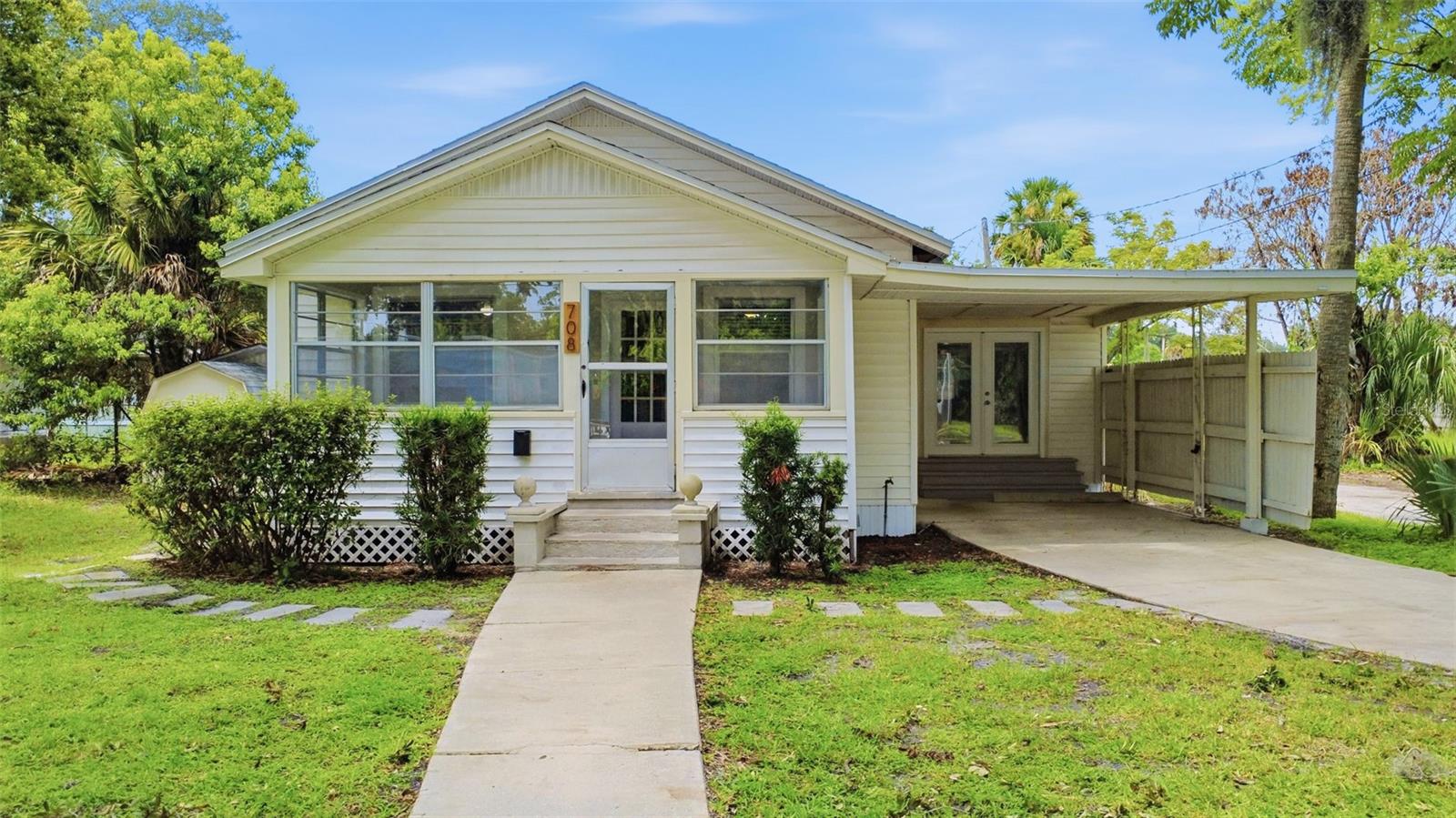 Virtually Staged. Welcome to this refreshed 3-bedroom, 2-bath bungalow-style Sanford home offering updated interior finishes and convenient access to one of Central Florida’s most active downtown districts. Inside, the home features new flooring throughout, fresh interior paint, and an updated kitchen with a clean, modern feel. The layout offers comfortable everyday living with a dedicated living room, functional kitchen space, interior laundry area, and a practical single-story design.

The home also includes a covered front porch, carport parking, and low-maintenance exterior features, making it a solid option for buyers seeking an updated property in a central Sanford location. The neutral finishes provide a move-in-ready visual appeal while still allowing the next owner to personalize the space.

Located near Historic Downtown Sanford, this property offers close proximity to Lake Monroe, the Sanford RiverWalk, Fort Mellon Park, Sanford Memorial Stadium, local restaurants, breweries, coffee shops, boutiques, galleries, farmers markets, festivals, and community events. Downtown Sanford is known for its vibrant small-town atmosphere, waterfront access, entertainment options, and growing local business scene.

Commuters will appreciate nearby access to major roadways, including I-4, SR 417, US-17/92, and SR 46, as well as proximity to SunRail, Amtrak Auto Train, and Orlando Sanford International Airport. Whether you are looking for a primary residence, investment opportunity, or a property near Sanford’s downtown amenities, 708 Celery Avenue offers appeal in a convenient Central Florida location.