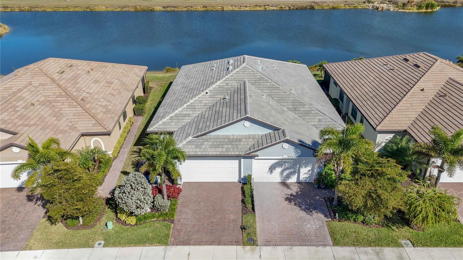 Impeccably maintained end-unit villa in the gated Preserve at West Villages, ideally located in the heart of Wellen Park. This light-filled 2 bedroom plus den home offers thoughtful upgrades throughout, including custom accent walls in the primary bedroom and office, hurricane shutters for peace of mind, closed-circuit security cameras, and built-in garage storage. Enjoy tranquil pond views from the paver patio, perfect for morning coffee or evening unwinding. Recent maintenance includes driveway and sidewalk cleaning and sealing, A/C serviced in October, and hot water heater cleaned in October.

The Preserve is a maintenance-free, gated community featuring a clubhouse, fitness center, heated resort-style pool, pickleball and bocce, all with low HOA fees that include exterior maintenance and landscaping. Just minutes to Downtown Wellen Park’s dining, shopping, farmers markets, concerts, and CoolToday Park, with easy access to beaches, I-75, and everyday conveniences. Furnishings are not included in the purchase price but may be negotiable. Ideal for full-time living or seasonal enjoyment—this villa offers comfort, convenience, and the best of the Wellen Park lifestyle.
