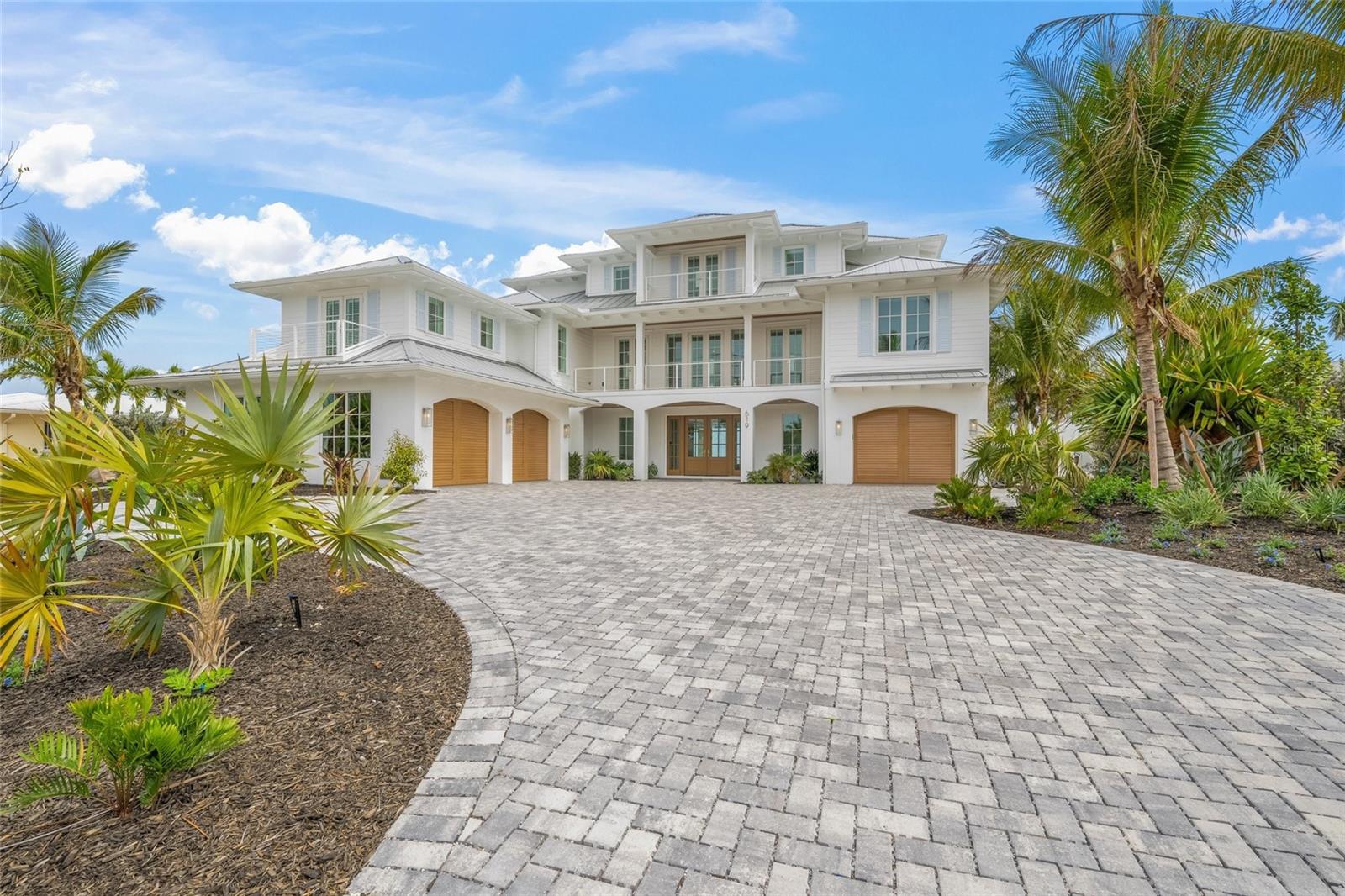Experience the pinnacle of coastal luxury with this newly constructed bayfront residence on Anna Maria Island. Offered fully furnished with high-end furniture, this home features top-tier Wolf and Sub-Zero appliances and a state-of-the-art Control4 home automation and audio-video system. Thoughtfully designed to capture sweeping panoramic views of Anna Maria Sound, this exceptional home offers five spacious bedrooms—each with its own en-suite bathroom, plus an additional full outside bath and two additional half baths for added convenience.

Perfectly positioned for boating enthusiasts, the property provides seamless access to the Gulf of America and Tampa Bay, with calm, protected waters ideal for sailing. The outdoor living space is a true retreat, featuring a resort-style pool and spa, a fully equipped outdoor kitchen with two Wolf grills, a full workout room, and impeccably designed areas for relaxation and entertaining.

Inside, you’ll find elegant stone countertops, custom cabinetry, and the convenience of a private elevator. A spacious three-car garage adds practicality, while the second floor offers a tranquil primary suite complete with a luxurious en-suite bath, private covered balcony with breathtaking views, and a home office. The third level includes a secondary living area, perfect for guests or multi-generational living.

Ideally located just moments from world-class dining, upscale shopping, and some of the most beautiful beaches in the world, this home offers the ultimate in refined coastal living!