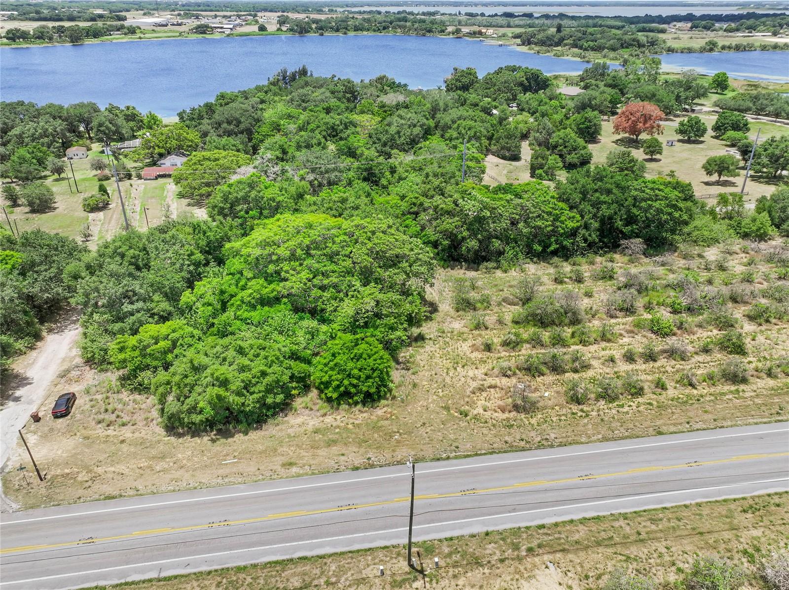 Build your dream home on this corner lot featuring .46 of an acre. This picturesque parcel is located in an established community with no monthly HOA. Conveniently located on a paved road near shopping, restaurants, schools, and Highway 27.  As a residentially-zoned property, it offers the flexibility to design and build according to your preferences. We recommend that the buyer conducts their due diligence with the city and/or county to familiarize themselves with any building restrictions and requirements. For your convenience, a well and septic system will be required. This fantastic lot is situated in Haines City. There is an additional .85-acre parcel available to purchase (MLS number P4930676). Take advantage of this exceptional lot and turn your vision of a dream home into a reality.