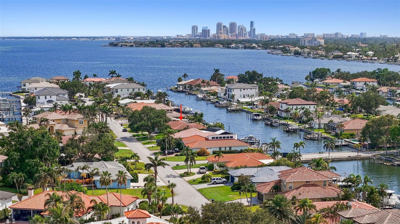 This well-appointed home is located on Carolina Ave. NE in the highly sought-after Venetian Isles community. Situated on an open-water canal with unobstructed access to Tampa Bay, this exceptional property offers the ultimate Florida boating lifestyle. What truly sets this home apart is its proven resilience and premier location. Positioned on one of the highest and most desirable streets in Venetian Isles, the property did not experience flooding during recent hurricanes—offering a level of peace of mind rarely found in waterfront living. Enjoy breathtaking water views, deep-water dockage, a new elevated seawall, and ample space for a large vessel or custom boat lift. The backyard is a private waterfront retreat featuring a newer custom Sekas pool with a heated spa, expansive entertaining areas, lush landscaping, a turfed yard, and direct access to some of the best boating, fishing, kayaking, and paddleboarding in St. Petersburg. Inside, the home offers 3 bedrooms, 2 full bathrooms, and a convenient guest powder room. The spacious primary suite showcases beautiful water views and includes an en-suite bathroom and a walk-in closet. The kitchen, living room, and family room flow seamlessly to the backyard, creating the perfect indoor-outdoor living experience while maximizing the stunning waterfront views. A large laundry room, located just off the two-car garage, provides additional storage and serves as an ideal mudroom. Venetian Isles is an established deed-restricted community with buried utilities, natural gas, and an optional HOA. Cruise from your private dock, hop on your golf cart to explore vibrant downtown St. Petersburg, or enjoy easy access to Tampa International Airport and St. Pete Beach. Walk to the neighborhood Islander Market or spend your weekends paddleboarding to nearby Weedon Island Preserve. Combining exceptional waterfront amenities, outstanding storm resilience, and a prestigious Carolina Avenue address, this is a rare opportunity to own a move-in-ready home in one of St. Petersburg's most desirable neighborhoods. Come experience why so many are proud to call Venetian Isles home.