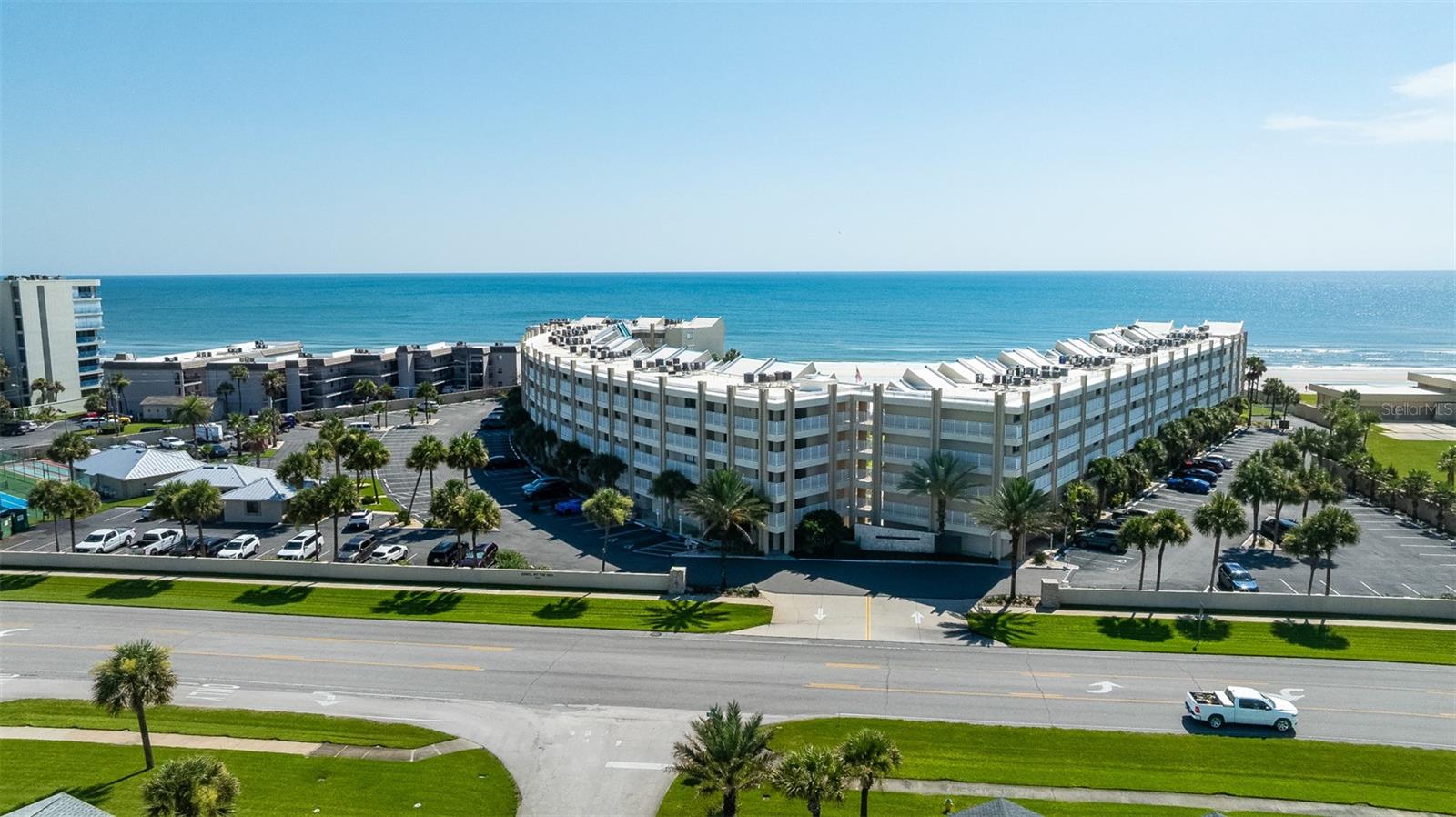 Enjoy amazing ocean views from this top floor 1-bedroom, 2-bathroom condo on the NO drive section of New Smyrna Beach, Florida!  The open living area is perfect for entertaining, giving you plenty of room to relax and enjoy the beautiful views of the water.  This unit is perfect for anyone looking for a peaceful beachside retreat and allows for monthly rentals. There are 2 pools, grill stations, a clubhouse, pickleball & tennis courts available to use. Located just minutes from shopping, restaurants, and all the great things New Smyrna Beach has to offer!
