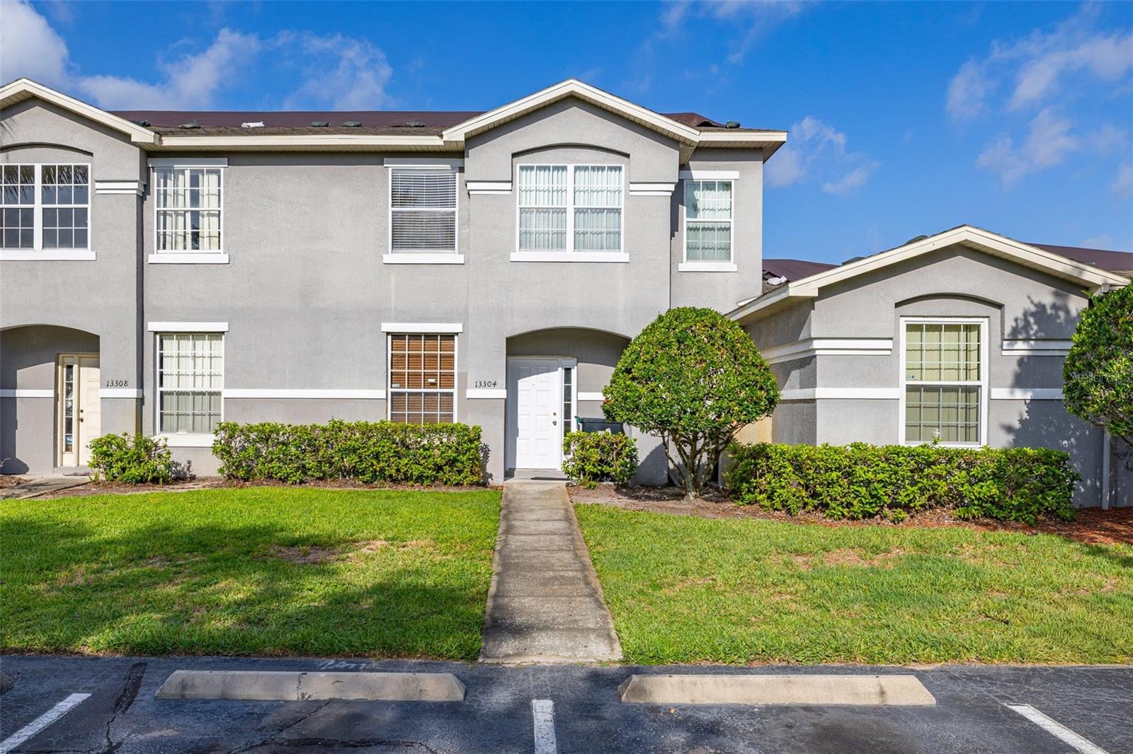 Welcome to this beautifully maintained **3-bedroom, 2.5-bath townhouse** in the desirable **Summerfield** community, where comfort, convenience, and low-maintenance living come together. Offering **1,543 square feet** of thoughtfully designed living space, this two-story home features soaring ceilings, an open-concept layout, and a spacious screened rear porch overlooking a large green space—creating the perfect setting to relax or entertain. 

Step inside to an inviting floor plan highlighted by abundant natural light, tile flooring throughout the main living areas, and an impressive two-story living room that enhances the home's open feel. The kitchen features granite-style stone countertops, ample cabinet space, stainless steel appliances, a breakfast nook, and a convenient pass-through to the dining area, making meal preparation and entertaining a breeze. 

The **first-floor primary suite** provides a private retreat complete with a walk-in closet and en-suite bathroom, while two generously sized upstairs bedrooms offer flexibility for family, guests, or a home office. A dedicated upstairs laundry area adds everyday convenience. 

Enjoy peaceful mornings or evening gatherings from the screened lanai overlooking the expansive backyard and green space. The community also offers a sparkling pool, beautifully maintained grounds, and guest parking, all with a low-maintenance lifestyle that lets you spend more time enjoying your home. 

Ideally located just minutes from Orlando International Airport, SR-417, Lake Nona Medical City, shopping, dining, and major employers, this home is perfect for first-time buyers, investors, or anyone seeking an affordable home in a prime Orlando location. With **no minimum lease period** (subject to HOA verification), it also presents an outstanding investment opportunity.