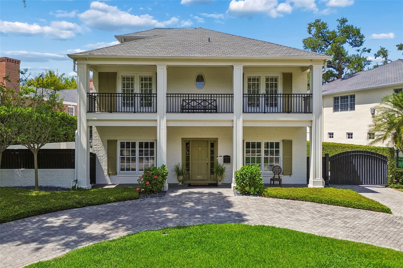 Located in the prestigious Golfview neighborhood, this beautifully renovated white brick residence blends timeless architecture with modern updates across a thoughtfully designed floor plan. Set on a quarter-acre lot, the property offers exceptional curb appeal with double front porches, a circular driveway, mature landscaping, and a detached two-car garage, while the backyard is designed for both entertaining and private outdoor living with a heated pool, brick sundeck, covered porch, side yard, and multiple patio spaces.

Inside, a gracious center hallway creates a classic and elegant flow, flanked by formal living spaces ideal for entertaining, lounging, or home offices. The home transitions seamlessly into a more open-concept layout at the rear, where the family room, dining area, and renovated kitchen overlook the outdoor living spaces and pool. The kitchen has been updated with inset cabinetry extending to the ceiling, premium Sub-Zero refrigeration, a 48-inch Dacor range, and refined finishes throughout. A private office and powder bath complete the first floor.

The second level is anchored by an expansive primary suite featuring three walk-in closets, a sitting room that could also serve as an additional dressing room or office, and a spacious bath with dual vanities, a garden tub, separate shower, and private water closet. Two additional bedrooms with French doors opening to the front balcony share a Jack-and-Jill bath, while a fourth bedroom includes its own en-suite bath. A generously sized laundry room with dual washers and dryers adds convenience to the upper level.

The third floor offers a flexible fifth bedroom and full bath that can easily function as a guest suite, office, fitness space, or bonus room, along with additional storage. Combining classic design, extensive updates, and a premier South Tampa location, this home offers a rare opportunity in one of Tampa’s most established and sought-after neighborhoods.