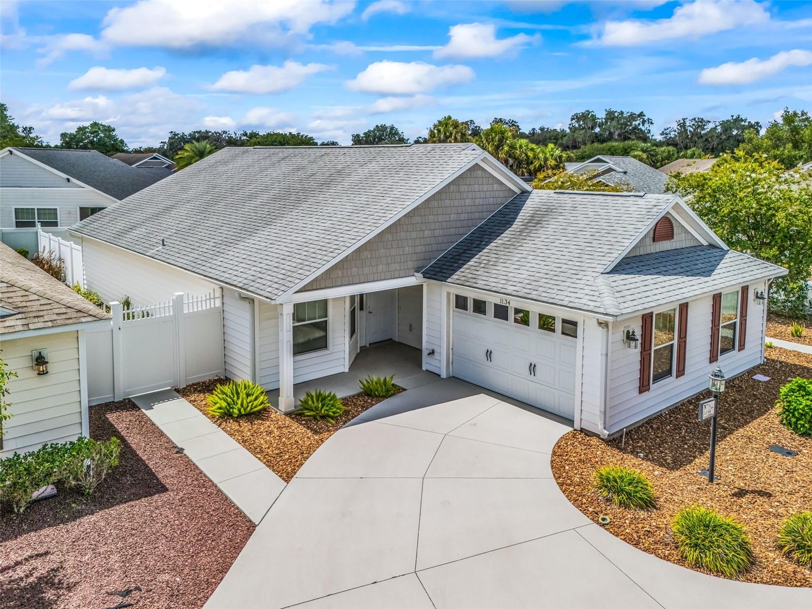 LOCATION, LOCATION, LOCATION! Live where others vacation in this FULLY FURNISHED 3 Bedroom/2 Bath Cumberland Cabana Courtyard Villa in the highly sought-after Village of Bridgeport at Creekside Landing, just a short golf cart ride—or leisurely walk—to Lake Sumter Landing Market Square! Enjoy nightly live entertainment, waterfront dining, boutique shopping, festivals, and everything that makes The Villages one of the nation's premier active adult communities. Situated on a rare OVERSIZED CORNER HOMESITE, this beautifully maintained villa offers 1,685 sq. ft. of climate-controlled living space and a spacious fenced courtyard that provides exceptional privacy and room to entertain, relax, grill, or let your pets roam. The oversized homesite creates the feel of a much larger property—an uncommon feature in a villa neighborhood. Step inside to discover an inviting OPEN FLOOR PLAN with high/vaulted ceilings, luxury vinyl plank flooring throughout the main living areas, tile in the wet areas, and NO CARPET. The spacious kitchen is designed for both everyday living and entertaining, featuring beautiful cabinetry with pull-out shelves, high-definition laminate countertops, a smooth-top electric range, closet pantry, and a large breakfast bar. The generous primary suite offers a spacious bedroom with high ceilings, a large walk-in closet, and an ensuite bath featuring dual sinks with granite countertops and a tiled walk-in shower. Two comfortable guest bedrooms, each with ceiling fans and ample closet space, provide flexibility for guests, a home office, or hobby room. The guest bath also features granite countertops and a tiled tub/shower combination. Enjoy seamless indoor-outdoor living with patio access from both the kitchen and primary suite, leading to your oversized private courtyard—perfect for morning coffee, outdoor dining, or entertaining family and friends. Additional features include an inside laundry room, Nova Water Filtration System, NEW HVAC (2025), and a NEW ROOF scheduled for installation, providing outstanding value and peace of mind. Patio to be Power washed and professionally cleaned after the new roof installation. Beyond the home, you'll love the convenience of living just minutes by golf cart to grocery stores, restaurants, medical offices, banking, shopping, recreation centers, executive golf courses, the Arnold Palmer Championship Golf Course, Lake Miona Regional Recreation Center, Seabreeze Recreation Center, and the neighborhood pool. Opportunities like this are rare! A fully furnished courtyard villa on an oversized corner homesite, just moments from Lake Sumter Landing, offering the perfect combination of privacy, convenience, and the unmatched Villages lifestyle. Don't miss your chance to make this exceptional home your own! So, what are you waiting for… schedule your private home tour today! This home is truly move-in ready and available for a quick close. Room Measurements and Square Footage are approximate and should be verified by buyer/buyer’s agent. All information is deemed reliable but not guaranteed.