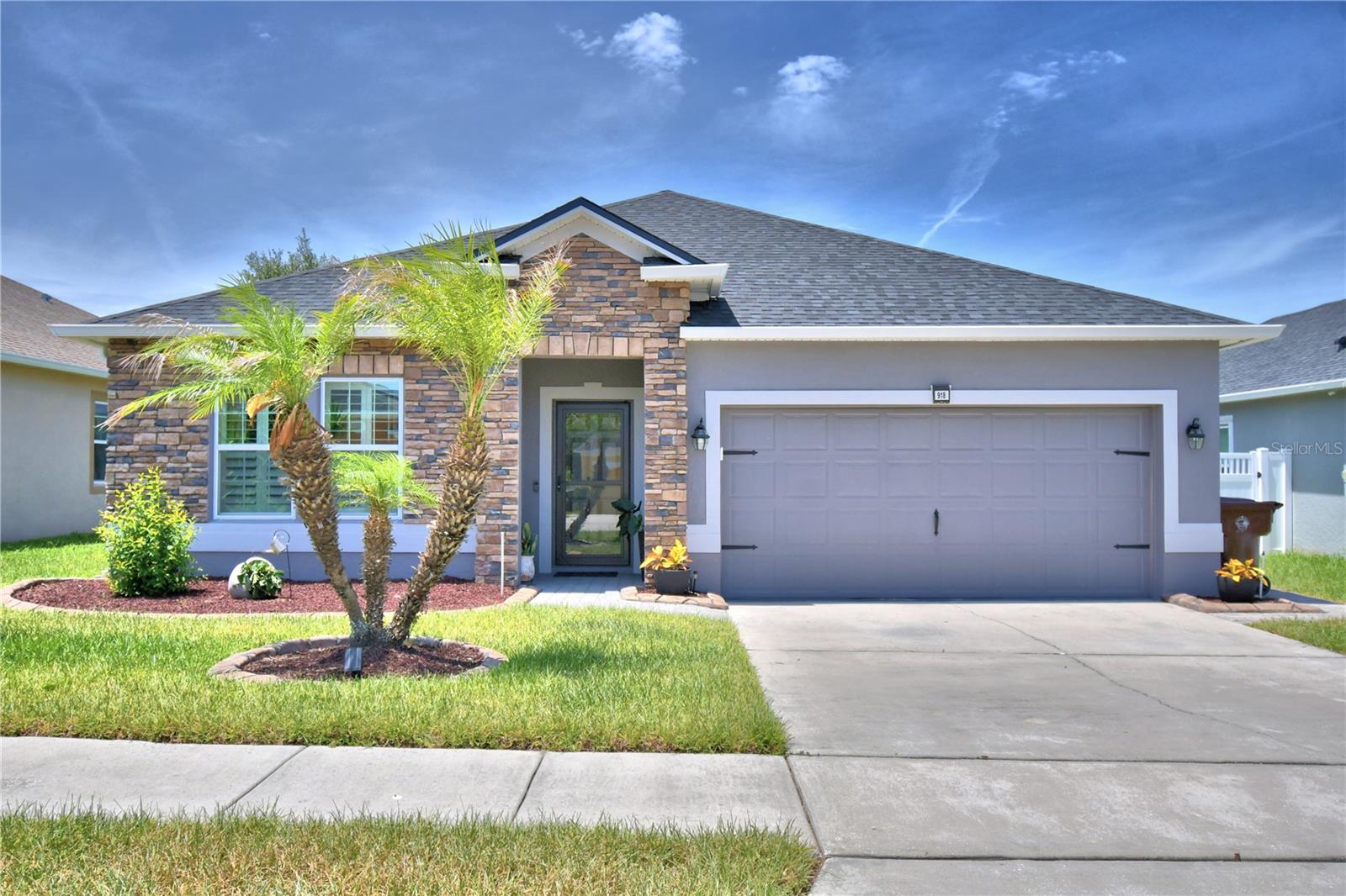 Welcome to this absolutely amazing 3 bedroom, 2 bathroom home with two bonus rooms and 2000 sqft of living area of modern luxury! Built in 2016 it offers a spacious and open floor plan with countless high-end upgrades that make it an extremely attractive property. BRAND NEW ROOF installed December 2025. The interior has beautiful ceramic tile flooring that flows throughout the living areas. The bright, open floor plan is enhanced by upgraded lighting and modern ceiling fans, adding a touch of sophistication and comfort. The gourmet kitchen adds flair wirh freshly painted cabinets, stainless-steel appliances, a large island with granite counter tops, a spacious pantry, and a custom-tiled backsplash. It is perfect for entertaining guests and undoubtably this kitchen is sure to impress. The owners suite is a luxury retreat, offering a spacious walk-in closet and a luxurious bathroom with upgraded sink, shower fixtures, upgraded lighting, a soaking tub for relaxing, a walk-in shower, dual sinks, and a separate water closet for added privacy. The secondary bedrooms are generously sized and share second bathroom with upgraded fixtures. The covered, screened lanai provides ample space for outdoor living and entertaining. The beautifully landscaped exterior, well maintained lawn and whole house water treatment system add to the appeal and beauty of this property. This exceptional home is move-in ready and offers comfort, style, and modern features in one package. Don't miss your chance to own this dream home!