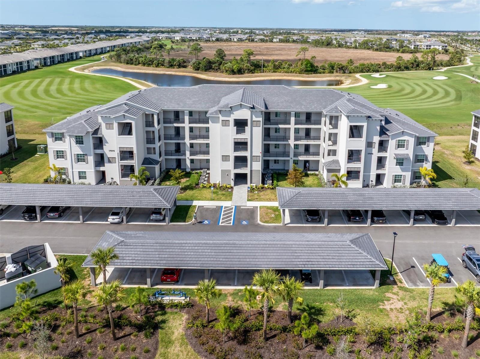 Virtually Staged. WOW! TOP FLOOR, END UNIT CONDO WITH GOLF MEMBERSHIP INCLUDED!
Experience elevated Southwest Florida living in this never-lived-in, top-floor, end-unit in Wellen Park Golf & Country Club, and yes, a full golf membership is included. One of the biggest advantages of this top-floor residence is the peace and quiet it provides, with no one living above you, creating a more private and tranquil setting. Even more exciting for buyers, LENNAR IS COMPLETELY SOLD OUT OF GOLF TERRACE CONDOS, making this a rare opportunity to purchase a brand-new unit without waiting!
The views from this home are truly spectacular. From the main living areas and lanai, you’ll enjoy an insanely BEAUTIFUL PANORAMIC VIEW overlooking the 5th and 6th holes of the golf course, with shimmering water and lush preserve creating a breathtaking backdrop. The popular Birkdale model features an open layout where the kitchen, living room, and dining area are perfectly positioned to capture these sweeping views through large windows and sliding glass doors.
Inside, the condo offers tile flooring throughout the main living areas and bathrooms, creating a clean and modern feel, while both bedrooms feature brand-new carpeting for added comfort. The spacious primary suite includes a walk-in closet and an en-suite bathroom with a tile shower and quartz countertop, offering both style and functionality. The guest bedroom is thoughtfully located near a full guest bathroom just steps away, making it ideal for visiting family and friends.
Living in Wellen Park means enjoying one of the fastest-growing master-planned communities in the country, known for its incredible lifestyle and amenities. Within Wellen Park Golf & Country Club, residents enjoy a stunning resort-style pool with a fun tiki bar, a well maintained 18-hole golf course with pro shop, tennis pro shop, tennis courts, pickleball, bocce ball, and a state-of-the-art fitness center with aerobics room, along with a dog park and active social atmosphere. A stunning clubhouse is currently under construction and anticipated to be completed in 2027.
Beyond the gates, you are just minutes from Downtown Wellen Park, featuring restaurants, shops, an 80-acre lake, scenic walking trails, and year-round events, along with easy access to Gulf beaches, boating, and everything that makes Southwest Florida such a sought-after destination. This is a rare chance to own a brand-new top-floor end unit with incredible golf views, offering the perfect blend of luxury, lifestyle, and location.