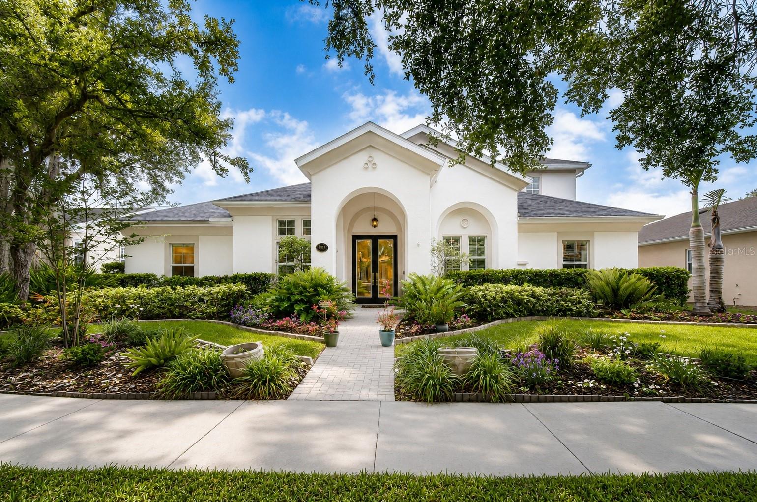 One or more photo(s) has been virtually staged. Your Florida dream home awaits in the award-winning community of FishHawk Ranch! This stunning WestBay executive pool home combines luxury finishes, spacious living, and resort-style outdoor spaces to create the ultimate Florida lifestyle. One of the home’s most valuable recent upgrades is the BRAND-NEW roof installed in 2025 by Westfall Roofing, complete with a transferable warranty for added peace of mind. New gutters were also installed at the same time, adding both function and curb appeal. Additional updates include a water heater replaced in 2023, newer pool heater, and an upgraded kitchen with beautiful modern finishes. Featuring 4 bedrooms, 4 bathrooms, a private office, bonus room, and a 3-car garage across more than 3,400 square feet, this home was designed for both effortless entertaining and comfortable everyday living. Nestled in one of FishHawk Ranch’s most sought-after villages, the home immediately captivates with lush tropical landscaping, manicured grounds, and impressive curb appeal. A paver walkway leads to the grand covered front entry and double 8-foot decorative glass doors, welcoming you into soaring 12-foot ceilings, an open-concept layout, and upscale finishes throughout. Just off the foyer, the executive office offers custom built-ins, a stunning stone fireplace, and elegant 8-foot glass French doors—creating the perfect work-from-home retreat. Across the hall, the formal dining room flows seamlessly through a butler’s pantry into the chef-inspired gourmet kitchen featuring quartz countertops, designer backsplash, stainless steel appliances, gas cooktop, oversized island, and abundant cabinetry overlooking the spacious great room and sparkling pool views beyond. Designed with entertaining in mind, the great room opens effortlessly through expansive 6-panel sliding glass doors to your private outdoor oasis. The luxurious owner’s retreat features laminate flooring, tray ceilings, barn doors, and oversized walk-in closets complete with custom California Closets organization systems. The spa-like ensuite offers dual vanities, a garden tub, and an oversized walk-in shower. Two additional bedrooms and baths are conveniently located on the first floor, while upstairs offers a large bonus room along with a private fourth bedroom and full bath—ideal for guests or multigenerational living. Step outside and enjoy true Florida living with a resort-style outdoor space showcasing travertine pavers, a free-form pool, heated spillover spa, and generous covered lanai perfect for year-round entertaining. Living in FishHawk Ranch means enjoying world-class amenities including resort-style pools, an aquatic center with a 32-foot waterslide and beach-entry pool, parks, playgrounds, miles of walking trails, shops, restaurants, and top-rated schools. This exceptional home truly offers the best of luxury, comfort, and community living. Schedule your private showing today!