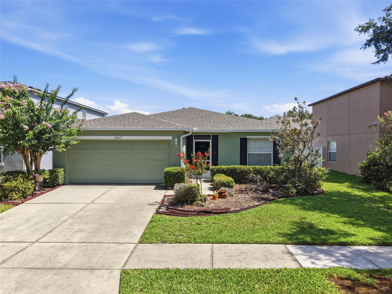 Welcome to this beautifully maintained single-story home featuring 3 bedrooms, 2 bathrooms, and a spacious open-concept floor plan designed for comfortable everyday living and entertaining. The home offers durable laminate flooring throughout the main living areas creating a warm and inviting atmosphere.

The well-appointed kitchen features maple cabinetry, Corian countertops, and a spacious eat-in kitchen area, and a new garbage disposal. Overlooking the main living and dining spaces, making it the perfect setting for everyday living and entertaining. The generously sized primary suite offers a private retreat with a large walk-in closet, dual vanity sinks, and a relaxing garden tub designed for comfort and relaxation.

Enjoy Florida living year-round from the extended screened patio overlooking the fully fenced backyard, complete with mature fruit trees that provide both beauty and fresh seasonal harvests. A charming screened front porch offers another inviting space to relax and enjoy the outdoors.

Additional highlights include a **NEW ROOF**, **NEWER A/C system**, a separate laundry room, and a washer and dryer that convey with the home. With its functional layout, thoughtful updates, and inviting indoor and outdoor living spaces, this move-in-ready home offers the perfect blend of comfort, style, and convenience. Don't miss your opportunity to make it yours!