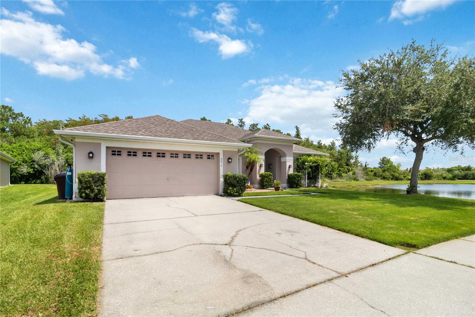 PRIVATE. UPDATED. MOVE-IN READY.

Welcome to this beautifully upgraded 5-bedroom, 2-bath single-story ranch home, ideally situated on one of the community's most desirable premium corner homesites. Surrounded by a tranquil pond and conservation area with no front, rear, or side neighbors, this exceptional property offers a rare combination of privacy, comfort, and modern living.

Step inside to discover a bright, open floor plan that lives much larger than its square footage, thoughtfully designed for both everyday living and entertaining. The highly desirable split-bedroom layout provides excellent separation between the spacious primary suite and the secondary bedrooms, creating comfort and privacy for family members and guests alike. Enjoy the convenience of single-story living with no interior stairs, offering easy, functional living for every stage of life.

Designed for both beauty and peace of mind, this home has been extensively updated with light modern designer finishes throughout, fresh interior and exterior paint, a replaced roof, and a replaced HVAC system, allowing you to move in and start enjoying your new home from day one. Elegant lighting, stylish fixtures, and quality finishes enhance the home's inviting atmosphere.

The spacious kitchen flows seamlessly into the living and dining areas, creating the perfect gathering space for entertaining or relaxing. Step outside to the oversized screened lanai featuring a spa, where you can unwind while enjoying peaceful pond and conservation views in your own private backyard retreat.

Conveniently located just minutes from Florida's Turnpike, Lake Nona, Medical City, shopping, dining, schools, and Central Florida's renowned attractions, this move-in-ready home delivers the perfect balance of privacy, thoughtful design, modern updates, and everyday convenience.

Opportunities like this are rare—schedule your private showing today and experience everything this exceptional home has to offer.