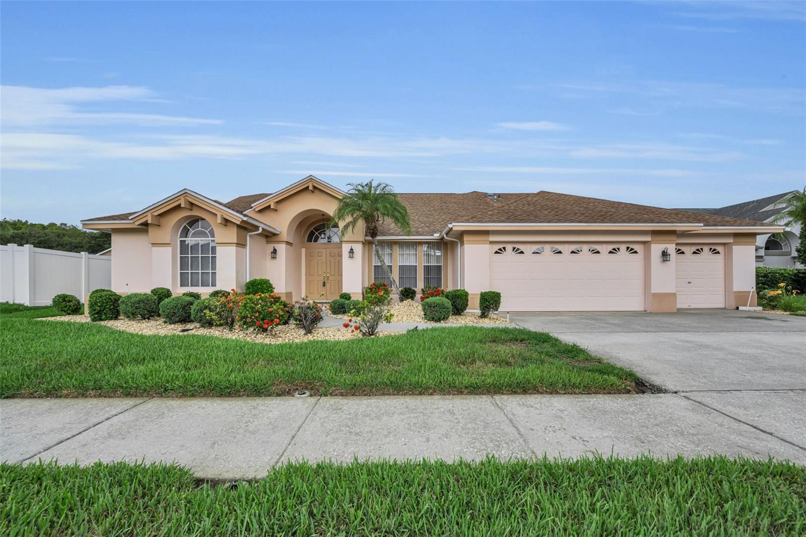Welcome to Wyndtree! This beautifully maintained 4-bedroom, 2-bathroom pool home offers 2,308 square feet of spacious living and an ideal floor plan designed for both everyday comfort and entertaining. Constructed with durable concrete block exterior walls, this home features separate living and family rooms, providing versatile spaces for gathering, relaxing, and hosting guests.

The spacious island kitchen is the heart of the home and features stainless steel appliances, abundant cabinetry, and a cozy breakfast nook with sliding glass doors that open to the screened pool area, creating a seamless indoor-outdoor living experience. A combination of tile and carpet flooring throughout adds both style and comfort.

Step outside to your private backyard oasis featuring a sparkling swimming pool, cool deck, and screened enclosure—perfect for enjoying Florida's year-round sunshine. The inviting family room showcases a cozy fireplace, creating the perfect setting for cooler evenings and family gatherings.

Additional highlights include an inside laundry room complete with built-in cabinetry and a utility sink, a sprinkler system, and numerous recent updates, including a new A/C (2020), new stove and refrigerator (2025), and new washer and dryer (2024). With low HOA fees of just $245 per quarter and a desirable location in the sought-after Wyndtree subdivision, this exceptional home offers the perfect blend of comfort, functionality, and Florida lifestyle living.