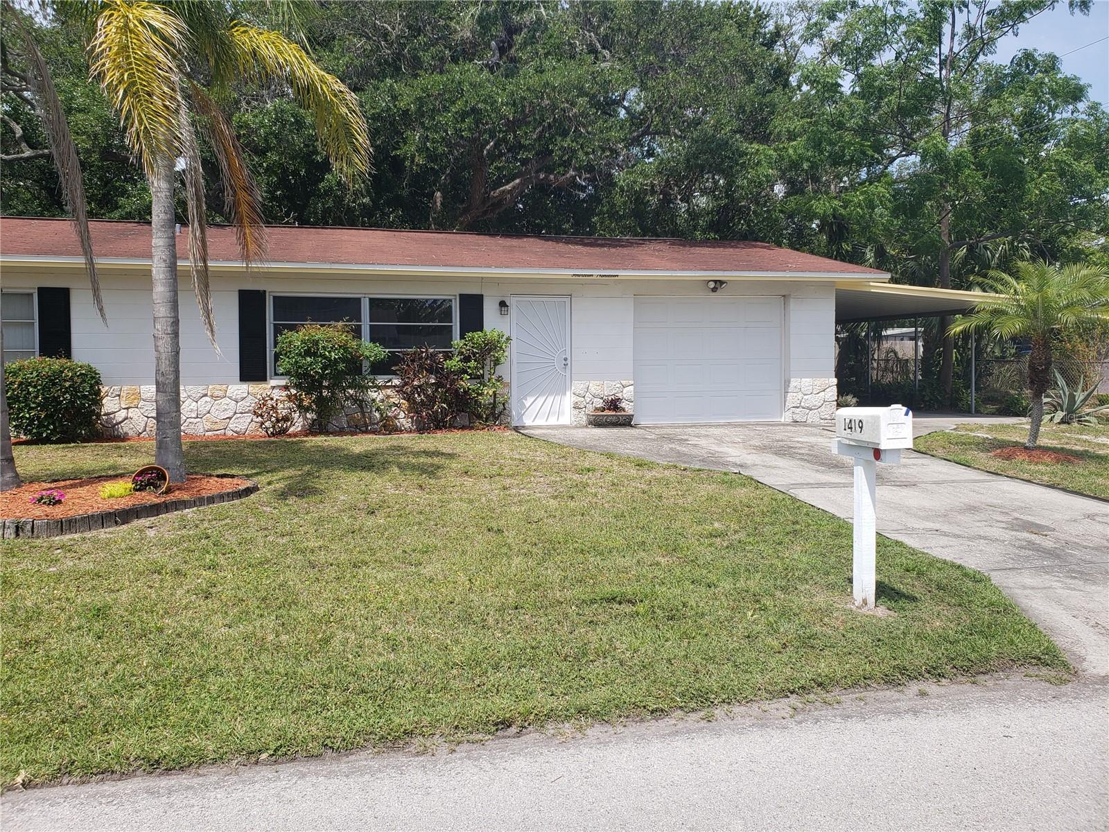 Beautiful Gulfport living at is best. A true 2 bedroom, 1 bath home. Hard to find 1/2 duplex with garage and carport. Outstanding floorplan. Updated flooring. Newer range and built in microwave. This is a very well maintained home in an great location. This is one half of a duplex. Other attached unit that faces Newton is currently rented.