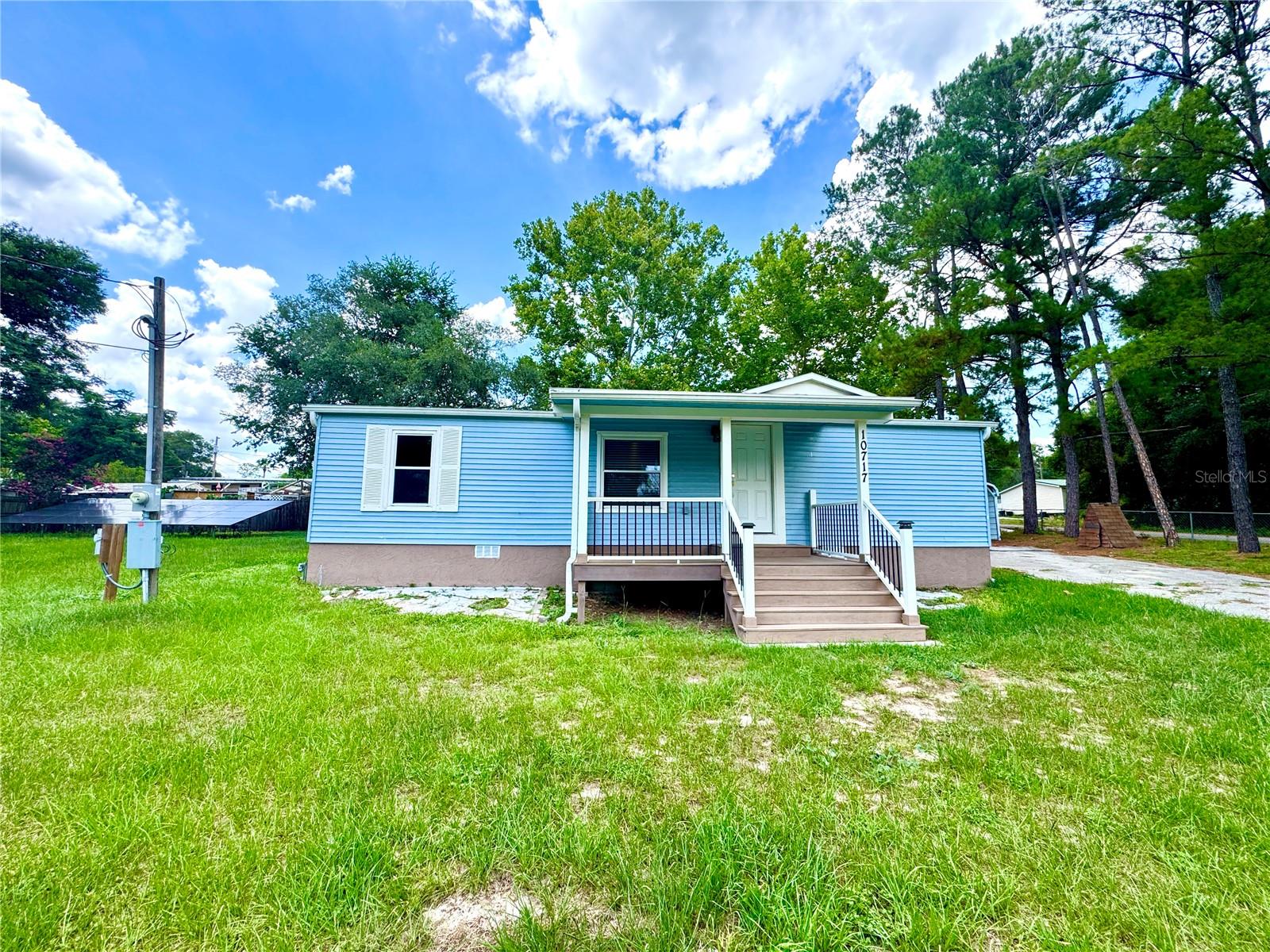 Corner lot, renovated and move-in ready! This beautifully updated 2-bedroom, 2-bath manufactured home sits on a spacious 0.38-acre lot in Belleview, offering the perfect blend of comfort, style, and functionality. Recent improvements include a new roof (2024), solar panels (2025), and extensive renovations throughout the home, creating a fresh, modern feel. The property features a well and septic system, carport, completely fenced, and plenty of parking for vehicles. Conveniently located near shopping, dining, schools, medical facilities, and just a short drive to Ocala and The Villages. Whether you're a first-time homebuyer, looking to downsize, or searching for an investment opportunity, this turnkey property is ready for its new owner. Schedule your private showing today!