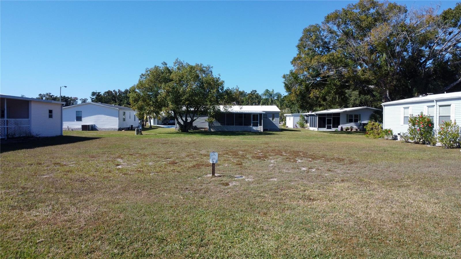 Welcome to Lot 79 in the highly sought-after, resident-owned Forest Glenn 55+ Mobile Home Park.
Nestled in peaceful Spring Hill, FL, this property offers an exceptional opportunity to build your ideal home in a community known for its quiet streets, friendly neighbors, and unbeatable convenience. With a low Co-Op fee of just $220/month, residents enjoy a generous list of included services and amenities: Lawn service , Dumpster service for household trash ,Community storage yard access, Full use of all Forest Glenn amenities : Featuring a community pool, clubhouse, shuffleboard courts, horseshoes, and a billiard room—perfect for staying active and enjoying the Florida lifestyle. The community also maintains all streets, storm drains, and street lights, ensuring a clean and well-kept environment year-round. Ideally located near Hernando Beach, residents have quick access to seafood restaurants, serene fishing spots, and unforgettable Gulf Coast sunsets. Nearby Spring Hill offers outdoor shopping plazas, hospitals, and medical offices for everyday convenience. For recreation, enjoy Weeki Wachee Mermaid Park, kayak the crystal-clear Weeki Wachee River, or soak up the sun at Rogers Park and Pine Island Beach. Lot 79 at Forest Glenn delivers affordability, comfort, lifestyle, and location all in one. Your Florida adventure begins here. Call to schedule your showing Now!