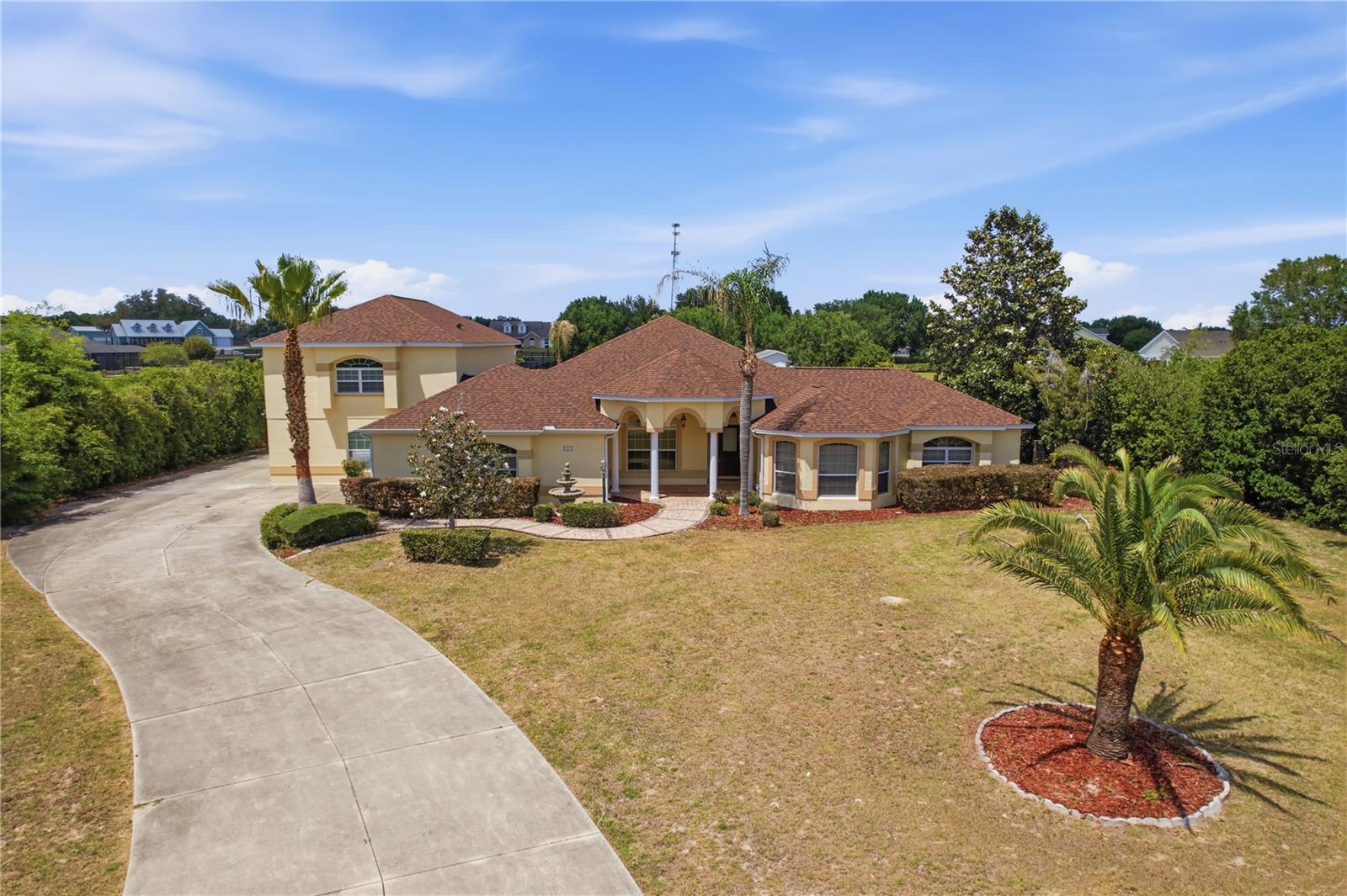 One or more photo(s) has been virtually staged. RARE OPPORTUNITY:  Sprawling 6-bedroom Fox Hollow Estate w/Media & Game room.  Pool & Summer kitchen.  Minutes from the Villages!  Situated on a generous, one plus acre country-sized lot in the highly desirable and low HOA community of Fox Hollow, this massive 6 bedroom, 4 bathroom pool home offers neutral colors, unparalleled space, freedom and luxury.  If you are searching for the ultimate multi-generational home, this estate delivers a resort-style experience of privacy and tranquility.  Finally a home where everyone fits!  Featuring two highly desirable ground-floor primary suites, this layout is perfectly equipped for multi general living and houseguests.  The two main floor primaries ensure easy accessibility and privacy, while the remaining 4 spacious bedrooms proved endless flexibility for family, dedicated home offices, Flex/Media or a fitness room.  Step outside to your private oasis featuring a screened in sparkling pool and a built-in summer kitchen the ultimate setup for Florida entertaining year round!  Experience the peace and privacy or country living with city convenience right at your doorstep.  You are just minutes away from Brownwood Paddock Square, world class golf courses, top tier medical facilities, shopping & dining!  Properties of this magnitude with these amenities rarely hit the market.  Don't miss your chance to own this private estate - schedule a visit today!   (Some rooms have been virtually staged)