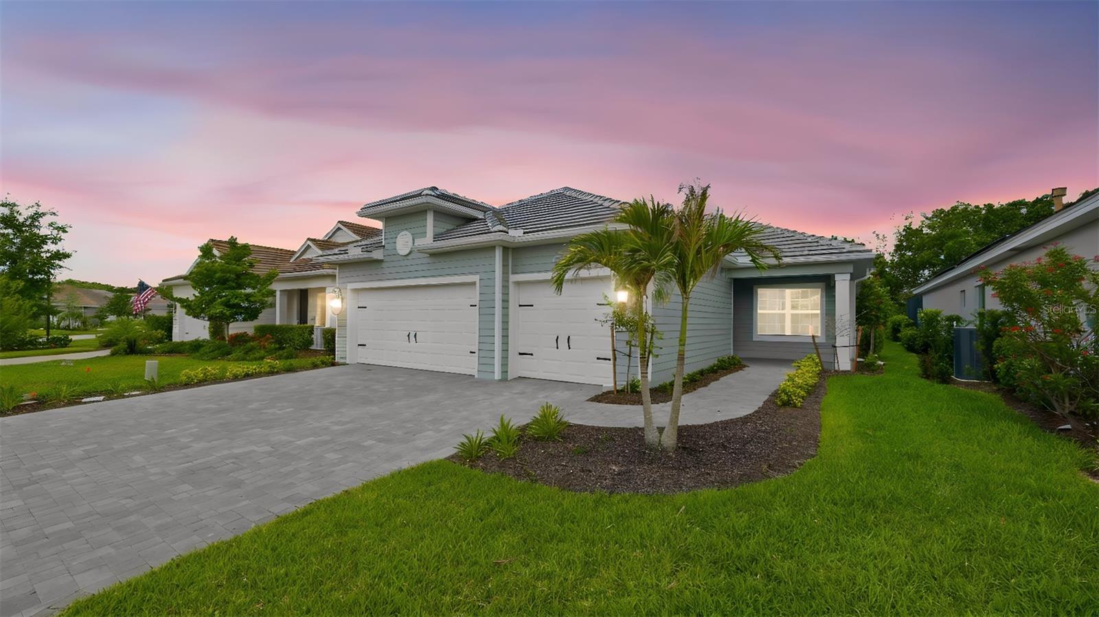 Virtually Staged. There are places you visit, and places you never want to leave. Verandah falls firmly in the second category. Set behind a private gate in Fort Myers, this is a community designed around living well — on your terms, at your pace. Two championship golf courses by Jack Nicklaus and Bob Cupp make it a golfer's dream, while the River House, resort-style pool, spa, fitness center, pickleball, tennis, kayaking, and miles of scenic trails make sure there's something for every kind of day. The social calendar keeps things lively year-round, but there's just as much room here for quiet mornings and slow afternoons.

This BRILLIANCE floor plan brings a thoughtfully designed living space, plus a 223-square-foot LANAI and an EXTENDED 3-CAR GARAGE. 3 bedrooms, 2.5 baths, and a DEN give everyone room to spread out, while the open Great Room flows into the kitchen and breakfast area through a POCKET SLIDING GLASS DOOR — blurring the line between inside and out.

The kitchen is built for both everyday living and entertaining, with a QUARTZ ISLAND, STAINLESS GE GAS APPLIANCE PACKAGE, and a FRENCH DOOR REFRIGERATOR. WOOD-LOOK PLANK TILE runs front to back through the main living spaces, and the Master Suite offers a spa-style bath with a FULL GLASS SHOWER ENCLOSURE and DUAL-SINK QUARTZ VANITY. WHOLE-HOUSE IMPACT GLASS means storm season is one less thing to think about.

Outside, PAVER FINISHES, a TILE ROOF, and INCLUDED PROFESSIONAL LANDSCAPING complete the look — with ROUGH-INS ALREADY IN PLACE FOR A FUTURE POOL AND OUTDOOR KITCHEN, should you want to take it even further.

If you've been searching for the right home in the right community at the right time — this might just be it. Some things are worth moving on quickly.