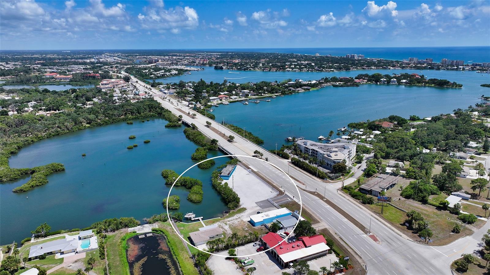 Located in the heart of Nokomis, Florida, 499-501-505 South Tamiami Trail offers an exceptional commercial property that combines a prime location with ample space, making it a perfect investment for a variety of businesses. This property is ideally positioned on a bustling thoroughfare, ensuring maximum visibility and easy access for clients and customers.
The property spans on an impressive area of 1.5 acres on 3 separate lots, providing 2 buildings, one with over 2,600 square feet and office space and the second building with over 3,000 square feet of versatile space suitable for various commercial uses. Zoned CG per county Zoning code. Whether you are looking to establish a retail store, office space, restaurant, marina or a combination of uses, this property offers the flexibility to meet your business needs. The layout is designed to accommodate high traffic, the 500 feet of waterfront with over 150 feet of dockage and one lift make it a very unique and ideal commercial investment.
One of the standout features of 499-501-505 South Tamiami Trail is its strategic location. The property can be accessed by water or road. Positioned on a major artery of Nokomis, it benefits from high daily traffic counts, ensuring your business will receive the exposure it needs to thrive. The surrounding area is a vibrant mix of residential neighborhoods and commercial establishments, creating a dynamic environment that attracts both locals and visitors.
The property boasts ample parking, a critical asset for any business operation. Easy access to the parking area ensures convenience for customers, enhancing their overall experience. 
In summary, 499-501-505 South Tamiami Trail in Nokomis, Florida, represents a unique commercial real estate opportunity. With its prime location, waterfront property, and versatile space, it is an ideal choice for entrepreneurs and established businesses looking to expand. Don’t miss the chance to secure a prime spot in one of Florida’s thriving commercial corridors.