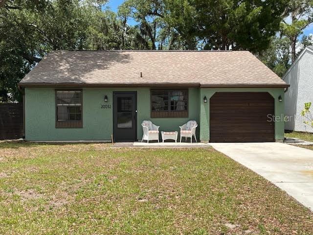 This home has been completely remodeled including top-of-the-line waterproof LVP flooring consistently running through the entire house (tile in bathrooms). The kitchen includes new, upgraded, 36" cabinets for better storage, level 3 granite countertops and new appliances. Both bathrooms have new vanities and hardware, and there are 5 new ceiling fans, 1 in each room. The garage has been converted to a dining room and interior laundry room for added convenience. Additional features include an instant hot water heater (so you're not paying the electric bill for constantly maintaining hot water), a leak monitoring system to alert you should any plumbing fixture fail, an irrigation system (not used or warranted by current owner), upgraded ceiling lights in the living room to give you either bright light or ambient light), a leaf-guard system on the gutters, and a fabulous, private back yard with patio for grilling or just relaxing and enjoying the outdoors.  The house has been freshly painted on the interior in neutral colors making it in move-in condition.

Oak Hollow is a welcoming subdivision where every house is picture-perfect, and the HOA monitors the exteriors to insure it remains that way. The Association offers a large variety of social amenities including a clubhouse, huge pool, recreational facilities, pickleball, tennis, shuffleboard, bocce, etc. And all this for only $208/quarter!  Oak Hollow provides a vibrant lifestyle for all its residents regardless of age or interests, and it's close to everything - shopping, schools, hospitals, the beach complex, restaurants!