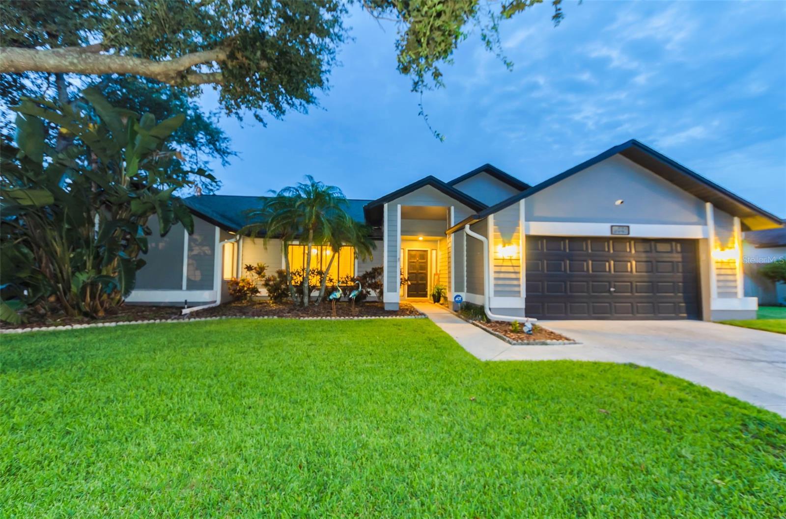 Move-In Ready! Coastal Elegant Comfort. Highly sought after Private Gated Community zoned for East Lake High and other 'A' rated schools. Centrally located with access to John Chestnut park, Lake Tarpon, and the Pinellas Trail for water sports, hiking, biking, and other outdoor activities. Nearby shopping, dining, golfing, and schools. Ridgemoor association has a central community park with basketball/tennis courts, playground, numerous walking paths, and deer. Your new home has been meticulously renovated and designed with a flow that is accommodating for family gatherings and entertaining. Your kitchen is host to soft-close cabinetry with pull-out pan drawers, striking quartz counters, and stainless steel appliances. Truly a relaxed gathering place as it provides ample space for eating at the counter as well as full dining area that opens to the lanai and pool for your Florida indoor-outdoor living. The spacious Family room has vaulted ceilings, high windows providing abounding sunlight, and a fireplace for basking in its warm cozy glow during cooler weather with capacity for all. Your separate Dining room invites all to gather and connect for family meals, holiday dinners, and special occasions. This area easily converted to a second family room, game room, library, activity room, multi-functional area, or whatever your family desires. The split floor plan provides privacy for your Primary Suite while your family and guests may enjoy their own private time in the three extra bedrooms and full bath. The second full bath provides access to the pool. Use as bedrooms, dedicated office, den, or work out room. Pocket door separates the family room. Your private Primary suite affords serenity and calm with a fully redesigned En-suite bathroom and electric fireplace exuding warmth, tranquility, and ambiance. With private access from your suite to the lanai and pool, you have your own Oasis! Your new home feels like a new build. With sliders at all access points from the inside living area to the lanai, your home becomes amazing Florida indoor-outdoor living!
*AC 2021/ Hot water heater 2024 /Pool Resurfaced 2022 /French drain 2023*