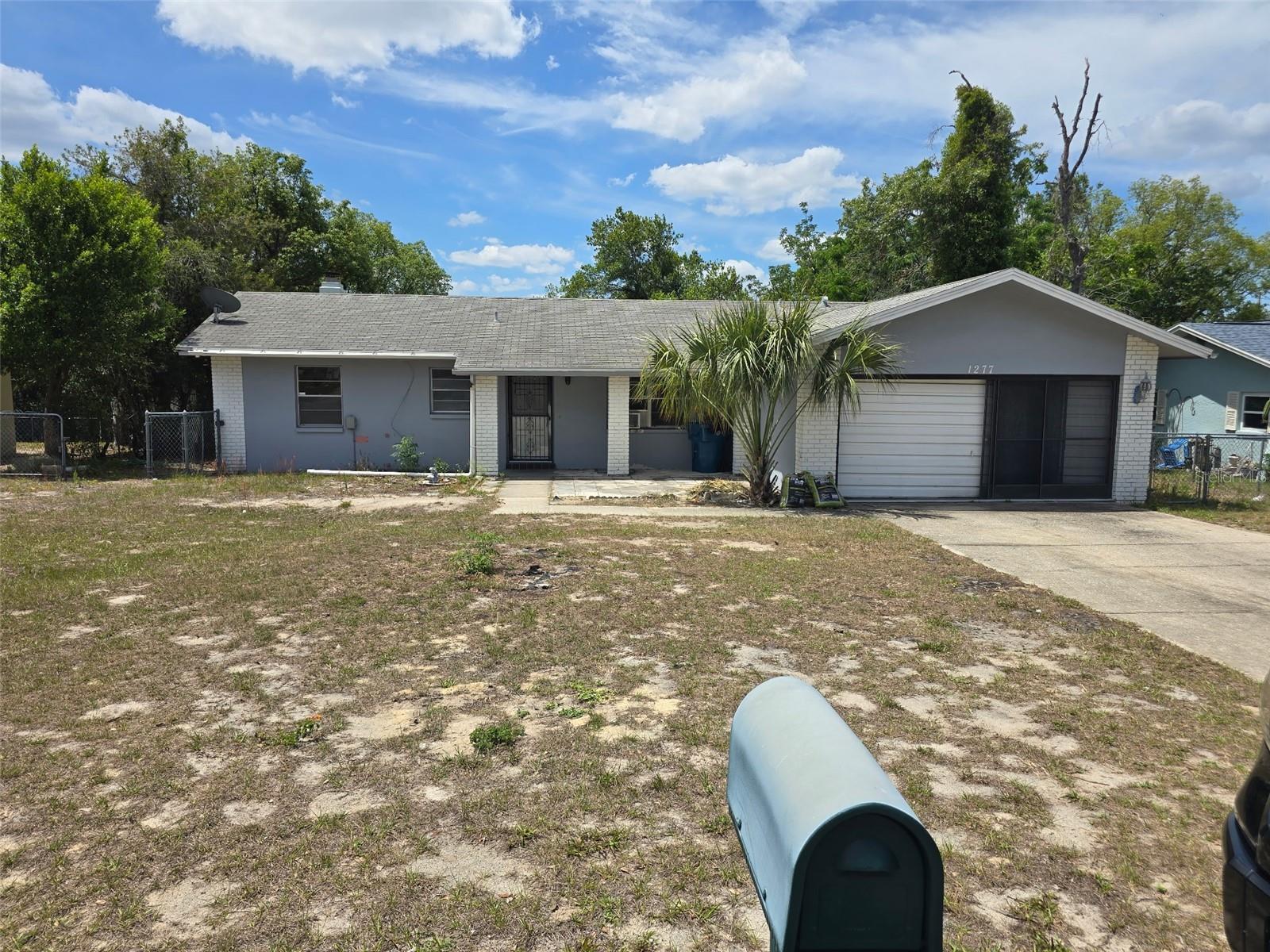 **Investor special with endless potential! This 2/2/2 is ready for a complete transformation and offers the perfect opportunity for investors, flippers, or buyers looking to create their dream home from the ground up. Situated on a spacious lot with mature landscaping, this home features a solid footprint and plenty of room to reimagine the space to your exact vision.

Flooring has already been removed in the bedroom areas, leaving a clean concrete subfloor ready for the flooring of your choice. The primary suite includes a walk-in closet and an on suite bathroom with tiled walk in shower.  The second full bath offers a tub/shower combination.

The full length attached Florida room will need to be re-walled on the interior.  AC currently not working so will need replacement or repair.  This home has been cleared out and is primed for a full cosmetic renovation, making it an excellent value-add opportunity for the right buyer.

Bring your creativity and vision—whether you're looking for your next flip, rental investment, or personal renovation project, the possibilities are endless. Cash or renovation financing only. Property is being sold as-is and priced to reflect its condition. Don't miss the chance to unlock the potential in this diamond in the rough—opportunities like this don't last long!
