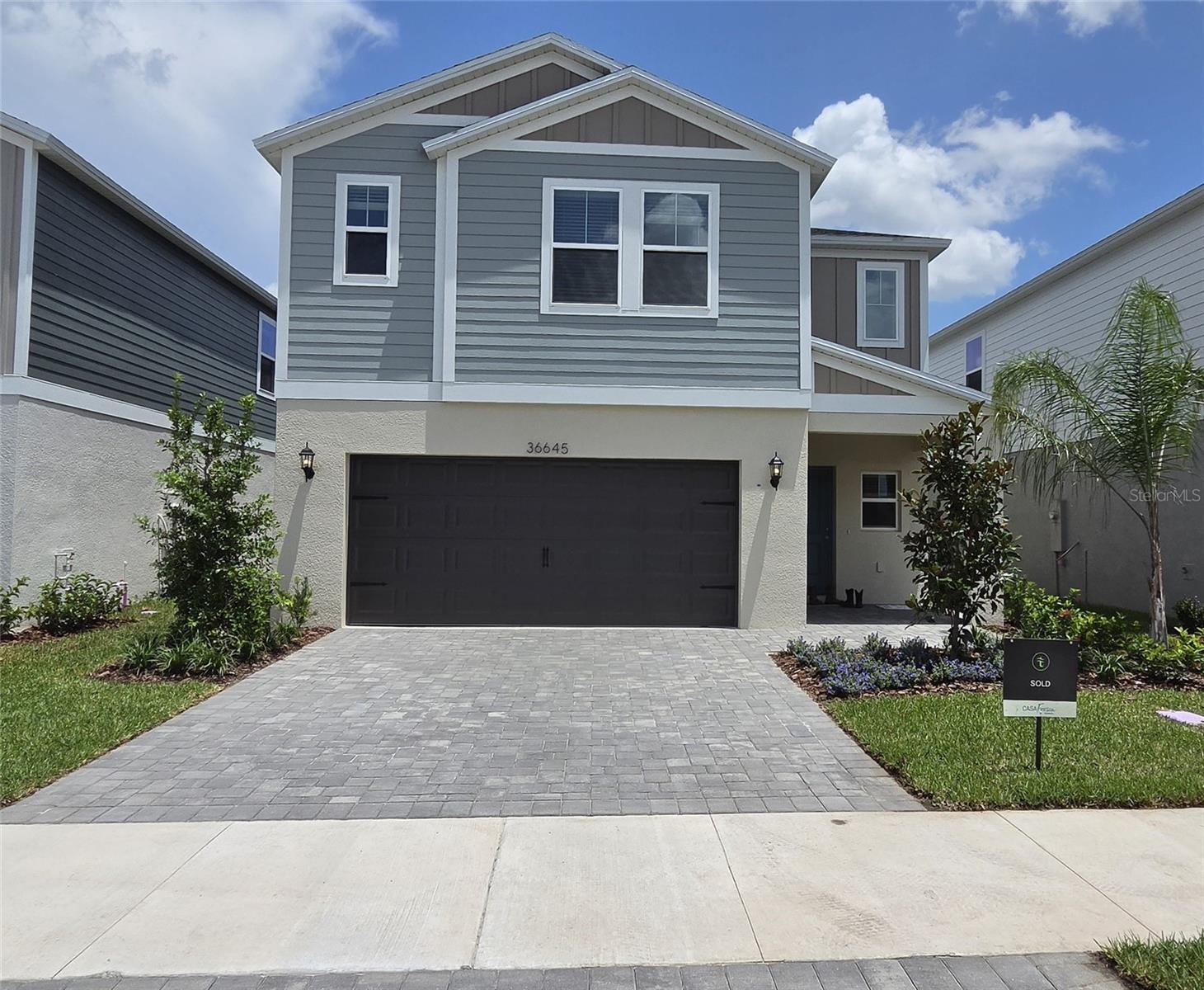 Be the first to occupy this brand-new, 2026-built Casa Fresca Indigo home in the vibrant Two Rivers community. House is available for rent starting August 1, 2026. This thoughtful 5-bedroom, 3-bathroom layout with a 2-car garage boasts soaring ceilings, luxury vinyl plank flooring, and modern finishes like quartz countertops, stainless-steel appliances, and a smart thermostat. Designed for flexible family living and entertaining, the floor plan features a secluded first-floor bedroom and full bath. Ideal for a guest or in-law suite. An expansive second-floor bonus room, a dedicated laundry room with washer and dryer hookups, and a luxurious owner's suite complete with a double vanity and spacious walk-in closet. Outside, sliding glass doors lead to the scenic pond view. Beautiful two rivers community offers scenic wooded landscapes, miles of walking/biking trails and exclusive access to The Nest amenity hub’s resort-style pool, playground, multiple pickleball courts, dog park, picnic tables, club house and dog park. Just 10 minutes from the shopping and dining at Wiregrass Mall and The Grove at Wesley Chapel. Please call today to schedule a showing.
