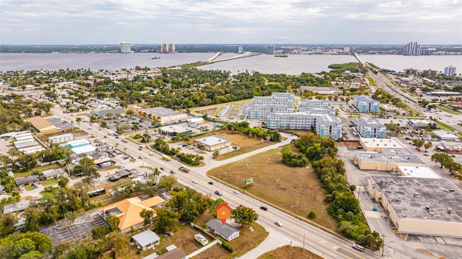 Explore the 3D Matterport Tour! Prime commercial opportunity in the heart of North Fort Myers along highly traveled Pondella Road. This stand-alone commercial building is zoned CS-2 (Special Commercial Office District) and is located within the North Fort Myers Community Plan Area, Land Development Code Section 33-1566, commercial properties with frontage on Pondella Road are subject to the North Fort Myers Commercial Corridor special regulations, which include their own permitted schedule of uses—creating additional flexibility and opportunity for a variety of commercial applications (buyer to verify intended use with Lee County). Remodeled in 2020 and being sold mostly furnished, the property offers approximately 1,100± sq. ft. under air (approximately 1,300± sq. ft. including the carport). The functional layout features multiple private offices, a conference room, reception area, kitchen, storage space, two bathrooms, and ADA accessibility. Additional highlights include a new roof in 2022, prominent corner positioning, excellent signage exposure, and strong daily traffic counts. Ideal for professional offices, medical or wellness practices, administrative services, and other service-oriented businesses. Whether you're an owner-user or investor, this property offers exceptional visibility, flexibility, and long-term potential within one of North Fort Myers' key commercial corridors.
