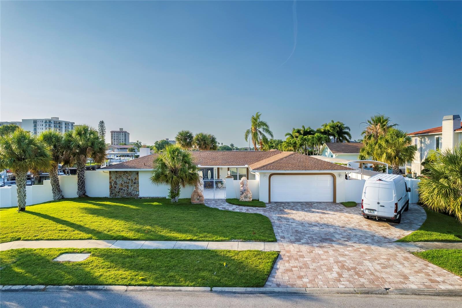 An exceptional opportunity to create your dream waterfront retreat in one of Clearwater’s premier boating communities. Situated on a prime deep-water canal, this 3-bedroom, 2-full-bath, 1-half-bath residence with a waterfront office offers the perfect foundation for a stunning renovation or a custom-built coastal masterpiece. Boating enthusiasts will love the private deep-water dock with direct access to the Gulf of Mexico, featuring two boat lifts designed to accommodate a 38-foot vessel and a 28-foot vessel, making sunset cruises, fishing excursions, and days on the water effortlessly accessible. The outdoor living experience is equally impressive, highlighted by a resort-style pool with cascading waterfalls, creating the perfect setting for relaxation and entertaining. Inside, the kitchen is equipped with top-of-the-line appliances and offers exceptional potential to create a chef-inspired culinary space tailored to your lifestyle.
Located in sought-after Island Estates, residents enjoy nearby dining, shopping, a convenient Publix, and world-famous Clearwater Beach just minutes away.