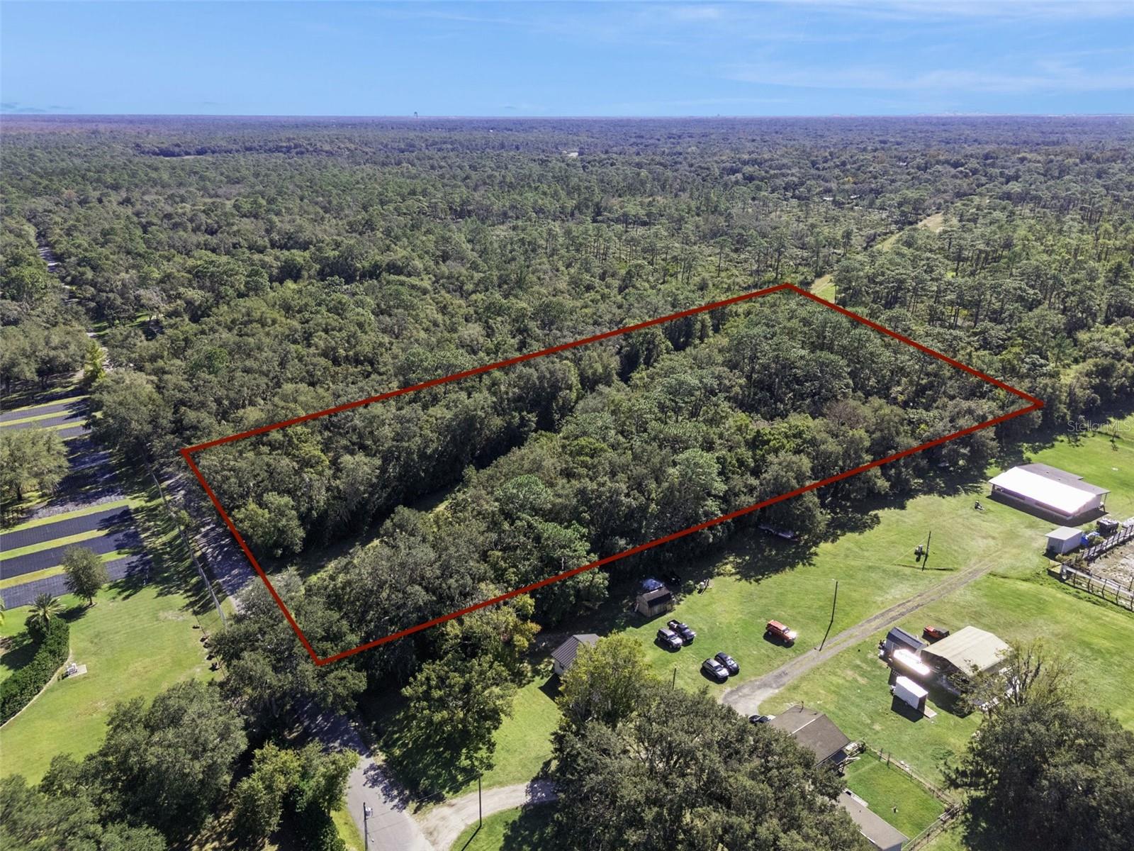 Rare opportunity to own a nearly 5-acre (4.8-acre) estate homesite in the highly desirable Wekiva Forest Trails, backing directly to Wekiva Springs State Park. Surrounded by mature trees and protected land, this property offers exceptional privacy and a true estate setting—just minutes from everyday conveniences.

The property offers ample space for a custom home, private driveway, pool, and additional outdoor living. Zoned A-2 (Farmland Rural), the property allows for equestrian use or a private hobby farm, with room for a stable, riding area, and pasture.

Located within the Wekiva Forest Trails Planned Development (PD), this is one of only eight estate-style parcels in a community where custom homes regularly exceed $1 million, maintaining a low-density, upscale character. No HOA and a minimum 4-acre lot size provide added flexibility.

Conveniently located near Wekiwa Springs, Kelly Park, and Rock Springs Run, with easy access to SR 436, SR 429, and downtown Apopka for shopping, dining, and top rated schools.