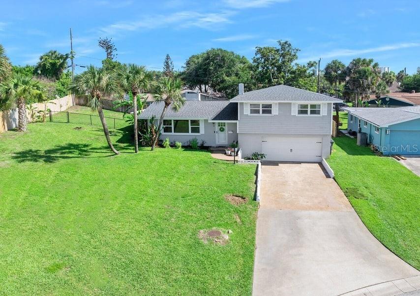 Beautifully renovated 3 bedroom, 2.5 bath with dedicated office perched high on a dune on one of the largest parcels in the neighborhood. This home looks great in the photos, but must be seen in person to be appreciated. Step in the front door to find a wide open living space filled with natural light. The great room here incorporates dining room, family room and a den all centered around the beautiful kitchen with casual dining at the breakfast bar. A powder room is tucked just inside the French doors that lead to the back deck where the sounds of the ocean and Atlantic breezes are enjoyed. The owners' suite here features an oversized bath with double vanities and a cavernous shower for two. Bedrooms 2 and 3 share a lovely common bath. The home office is isolated in a quiet corner of the home overlooking the sprawling green lawn. Two car garage is deep and offers extended storage. More...

Just a short stroll to a quiet stretch of traffic free beach via a neighborhood path and walkover to the sand.