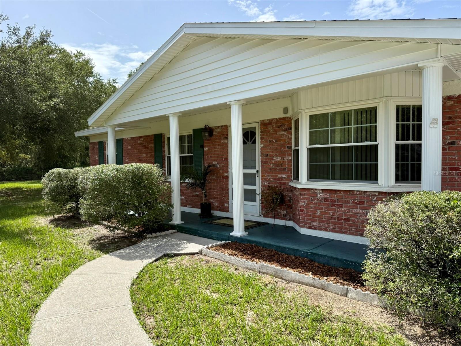 Welcome to your own private slice of Old Florida! Situated on 2.44 fully fenced acres in the heart of Seffner, this 3-bedroom, 2-bathroom, 2-car garage home offers the perfect combination of privacy, space, and convenience. A gated drive-through entrance with a locking gate provides added security, while the long driveway offers ample parking and room to add a parking pad for your boat, RV, or additional vehicles. Step outside and discover the true highlight of this property—a spacious 31' x 16' screened-in swimming pool complete with an inground spa that cascades into the pool, creating the perfect setting for relaxing or entertaining. The expansive pool deck provides plenty of room for outdoor seating, and the pool patio table and chairs are included with the home. The backyard offers peaceful views with a blueberry farm as your rear neighbor, giving you a tranquil country feel while remaining less than five minutes from Interstate 4, making commuting to Tampa, Orlando, and surrounding areas quick and convenient. The property is enhanced by beautiful, mature oak trees and a stunning magnolia tree, providing shade and timeless Florida charm. Additional features include a permitted shed and a well pump house, both with electricity already connected, offering excellent storage, workshop, or hobby space. This home has been lovingly maintained over the years and features several important updates, including a roof replaced in 2015, A/C system installed in 2014, and rear doors replaced in 2013. A generator is also included, providing additional peace of mind. While the interior offers an opportunity for cosmetic updates to match your personal style, the home's solid maintenance, expansive acreage, and exceptional outdoor amenities make it a rare find. Whether you're looking for room to spread out, space for your recreational toys, or simply a peaceful retreat with easy access to city conveniences, this property offers endless possibilities. Don't miss your opportunity to own this unique Seffner property where privacy, functionality, and location come together on nearly two and a half beautiful acres.