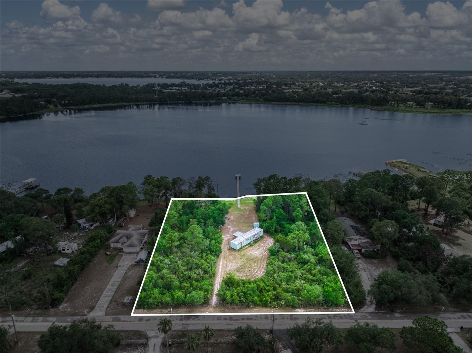Rare lakefront opportunity on Little Redwater Lake offering exceptional flexibility and future potential. This unique property includes a 2-bedroom, 2-bath manufactured home and encompasses three separate buildable lots (Lots 3, 4, and 5) with a combined total of 1.64 acres, creating possibilities for homeowners, investors, and builders alike. Live in the existing home on the center lot while retaining the option to sell the adjacent lots, create a family compound, or develop up to three separate homes. A recently replaced dock provides convenient access to the lake, where you can enjoy fishing, kayaking, boating, and other outdoor recreation right from your backyard. Take in peaceful water views and stunning Florida sunsets from this exceptional waterfront setting. The expansive property offers ample space to expand, build, or customize to fit your vision. Whether you're seeking a private waterfront retreat, income-producing investment, or future development opportunity, this property offers rare versatility. Conveniently located just minutes from downtown Avon Park, you'll enjoy easy access to local shops, restaurants, and everyday conveniences, while Sebring's medical facilities, entertainment, and amenities are only a short drive away. Nearby parks, lakes, and recreational destinations provide endless opportunities to enjoy the Florida lifestyle. Properties offering lakefront access, three buildable lots, and multiple development options are increasingly difficult to find. Don't miss this unique opportunity to own a versatile waterfront property with tremendous potential. Schedule your private showing today.