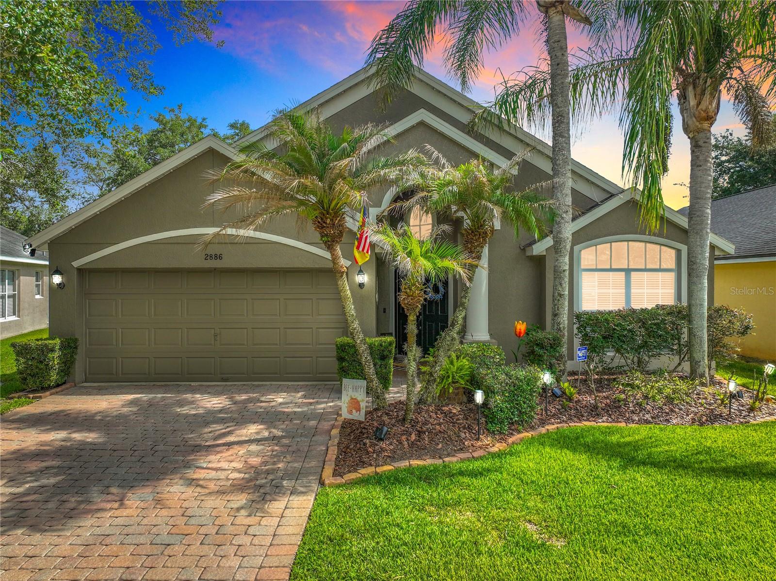 Welcome to this beautifully maintained 4-bedroom, 2-bath pool home in the highly sought-after Sanctuary community of Oviedo. Nestled on a quiet street, this inviting residence offers a versatile floor plan designed for both everyday living and entertaining. Upon entry, you'll appreciate the volume ceilings, abundant natural light, and attractive low-maintenance laminate flooring. The spacious front living and dining area provides endless flexibility and can serve as a formal living room, casual gathering space, home office, or even a game room. The private owner's suite features volume ceilings, a large transom window, a spacious walk-in closet, and an ensuite bath complete with dual vanities, a garden tub, separate shower, and private water closet. At the heart of the home, the kitchen overlooks the dinette and family room, creating the perfect gathering space. Featuring stainless steel appliances, granite countertops, and ample prep space, the kitchen is ideal for both daily living and entertaining. French doors from the family room lead to your own fenced backyard retreat. Relax on the patio with your morning coffee or unwind in the evening while overlooking the sparkling pool, installed just two years ago and featuring a low-maintenance design and sun shelf. Thoughtful outdoor features include vinyl fencing, decorative rock landscaping, turf pet areas, and pet doors to keep four-legged family members happy. Bedrooms two, three, and four are privately situated toward the rear of the home. Residents of The Sanctuary enjoy an impressive array of amenities including a resort-style pool, splash pad, clubhouse with fitness center, basketball, tennis and pickleball courts, soccer field, and multiple playgrounds. Zoned for highly rated "A" Seminole County schools and conveniently located near UCF, Seminole State College, Publix, Orlando Sanford International Airport, Orlando International Airport, and major roadways, this home also offers easy access to thousands of acres of state and county forests and is approximately 45 minutes from Florida's beautiful beaches. Don't miss the opportunity to own this exceptional pool home in one of Oviedo's most desirable communities. Schedule your private showing today!