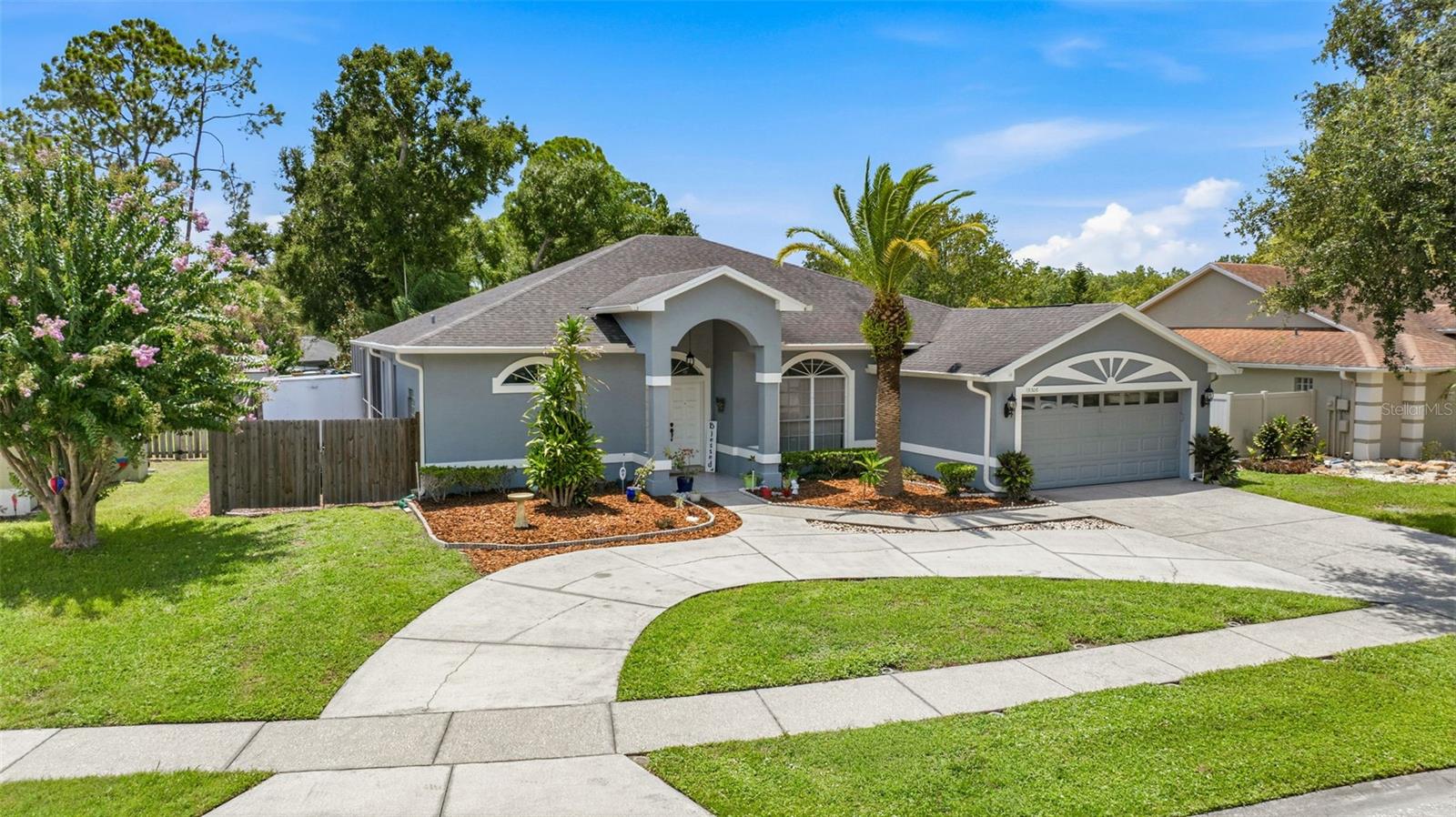Rare opportunity to own in Carrollton! Welcome to this beautiful 4-bedroom, 3-bath pool home offering 2,500+ heated/cooled square feet with a 2-car garage, ideally located in one of Carrollwood's most desirable communities. Carrollton is an exclusive, private, one-street cul-de-sac neighborhood of just 25 homes, where properties rarely become available. In fact, only one home has sold in the community over the past four years, reflecting exceptional pride of ownership, remarkable community stability, and the enduring appeal enjoyed by its residents.

Upon entering, you'll be welcomed by a spacious foyer that opens to the formal living room, showcasing gorgeous, luxury maintenance-free gray vinyl plank flooring that continues throughout most of the home's non-wet living areas. Sliding glass doors provide inviting views of the screened lanai and heated pool, making outdoor living and swimming enjoyable throughout Florida's cooler winter months.

The updated kitchen is designed for both everyday living and entertaining, featuring abundant cabinetry, acrylic countertops, a new refrigerator, bar seating for 4-6, and a spacious kitchen nook overlooking the pool and lanai. The kitchen flows seamlessly into the generously sized family room, complete with a cozy wood-burning fireplace, beautiful pool views, and direct access to the pool area through sliding glass doors.

The spacious primary suite also offers peaceful views of the pool and lanai, dual walk-in closets, and an en-suite bath featuring dual vanities, a stand-up shower, and a relaxing Jacuzzi soaking tub accented by a glass block window.

The considerably oversized second bedroom is large enough to serve as a second primary suite or an ideal guest retreat, complete with a walk-in closet and convenient access to a full bath just outside the door. Bedrooms three and four are also generously sized and share a full bathroom conveniently located between them. With its spacious rooms, thoughtful split-bedroom floor plan, and multiple living areas, this home offers exceptional flexibility to accommodate today's lifestyle needs.

The covered, screened lanai provides the perfect setting for outdoor dining, entertaining, or simply relaxing in the shade while overlooking the heated pool. Additional highlights include an interior laundry room just off the garage and a spacious half-moon driveway offering generous off-street parking for multiple vehicles and guests.

Conveniently located near an abundance of shopping, dining, and everyday conveniences including Whole Foods just over a mile away, this home combines privacy with an outstanding location.

Don't miss this rare opportunity to own a beautiful pool home in Carrollton, one of Carrollwood's most exclusive and tightly held neighborhoods.