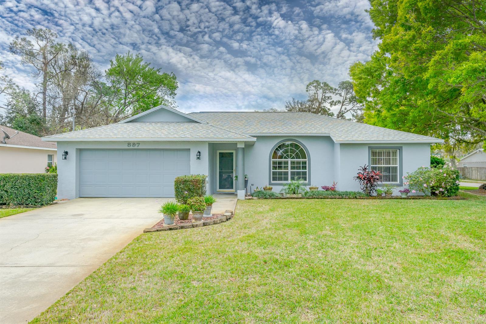 This could be the one for you! Beautiful 3 Bed/2 Bath Mike Pryor Split Plan Home situated on a corner lot with views of the Riviera Golf Course right out of your front window. Kitchen has been updated with Plank Tile Flooring; Black Appliances to compliment the beautiful Formica Counter-tops. Garbage disposal and Self Cleaning Oven. Dishwasher and Microwave in place. Up-lighting for a little extra lighting. Dining area perfectly placed for all your Family Time Meals. The Lanai has been enclosed with cooling and heat making it the perfect Florida Room to add some extra sitting area for your Family and Friends to enjoy. Owners Suite situated for privacy with a Walk in Closet; Owners Bath with Cultured Marble Vanity and Shower.

Guest Bed 2 gives you the perfect office/guest room with a Queen Size Murphy Bed (California Closet Product) in place and office desk built in, great for a home office. Guest Bed 3 gives you plenty of room for your King Size Guest Bed and room for your extra bedroom furnishings. Guest Bath Vanity with under lighting; New Toilet (3 years) and Shower/Tub with Transom Window to allow natural lighting shine thru. Outside Paver area perfect for the BBQ and Nice Patio Furniture for your Weekend BBQ's with Family and Friends. Fence is a shared fence (2 years old); AC/Water Heater 2008;Roof 2.5 years old; Deep Well Irrigation for Sprinkler System; Attic has partial flooring; Lava Rock in Landscaping and New Smoke Detectors in place! All measurements and information deemed to be accurate but cannot be guaranteed. Buyer/Realtors advised to verify. ;Water: City