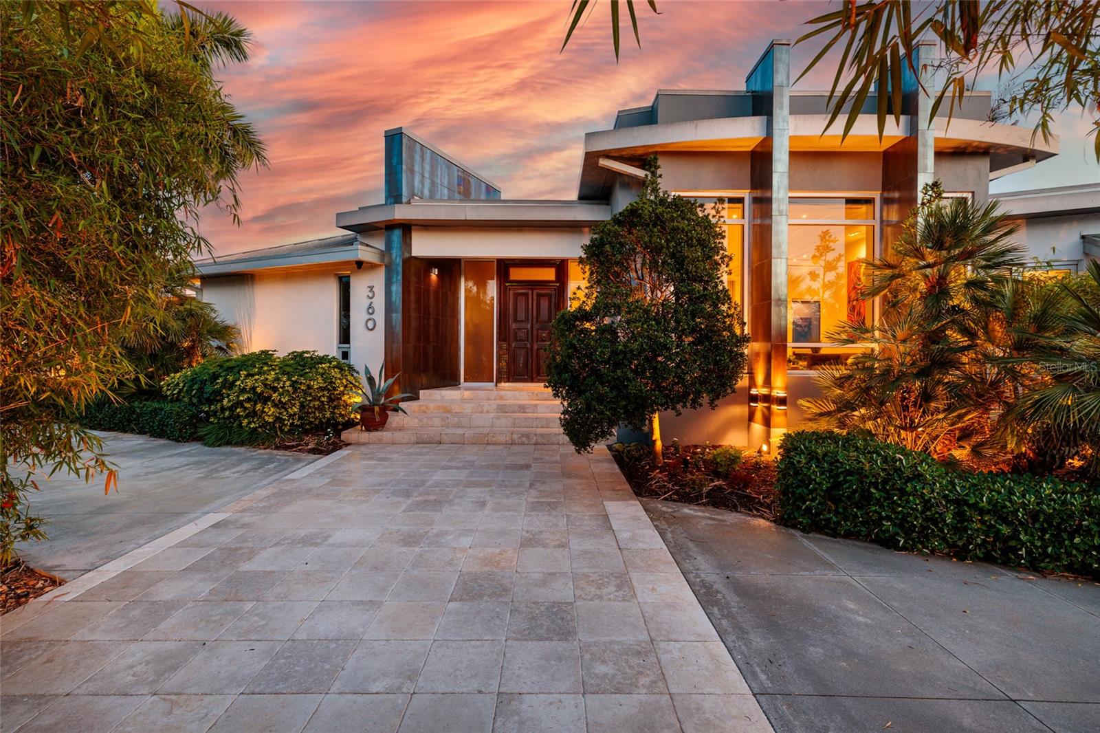 Under contract-accepting backup offers. There are homes… and then there are experiences.

Welcome to a meticulously maintained waterfront residence in one of St. Petersburg’s most desirable coastal enclaves—where panoramic water views, with morning sunrises and sunsets unfolding from nearly every room and each space reveals something unexpected, something memorable.

Spanning more than 3,800 heated square feet, this 3-bedroom, 3.5-bath home is a masterclass in waterfront luxury, blending contemporary industrial finishes with warmth and character that feel both elevated and inviting.  Be sure to look at all the photos to see the list the special features.  

At the heart of the home, a striking chef’s kitchen anchors the experience, thoughtfully designed for both function and connection. Premium appliances, custom cabinetry, and expansive surfaces create a natural gathering place whether entertaining two or ten.

And then come the surprises.

A private guest suite tucked away for ultimate privacy.
A shared patio retreat connecting two guest suites.
A primary suite sanctuary complete with its own screened porch.
A dramatic floating office space that feels suspended above the home, offering privacy, inspiration, and calming water views.
An additional bonus room adds yet another unexpected layer of flexibility—ideal as a media room, fitness space, playroom, or additional guest retreat..

At every turn, the home reveals itself in new and unexpected ways, creating a true sense of discovery that is both rare and unforgettable.

Step outside and the lifestyle truly unfolds. Expansive outdoor living areas surround a resort-style saltwater pool, both heated and chilled, inviting year-round enjoyment. The outdoor kitchen, dining spaces, and lush lawn create the perfect setting for gatherings that stretch long into the evening.

Follow the path to your deep-water dock with a deep water 13,000 lb boat lift, where spontaneous boating days begin and sunset cruises become routine with sailboats having easy access to the bay due to no bridges. Above it all, a sky observation terrace offers a breathtaking vantage point—watch dolphins glide through the water and take in sweeping views of Tampa Bay.  

Built for both beauty and peace of mind, the home includes hurricane-rated windows, a metal roof, whole-house generator, updated systems, and integrated smart home technology for seamless modern living.

This is more than a home.

It’s a private waterfront sanctuary—an inspiring, inviting everyday getaway.

PS.  This home did not take on any water during Helene.  There was water in the garage during Milton from driving rain and wind.  Assumable flood policy is $2929/year.