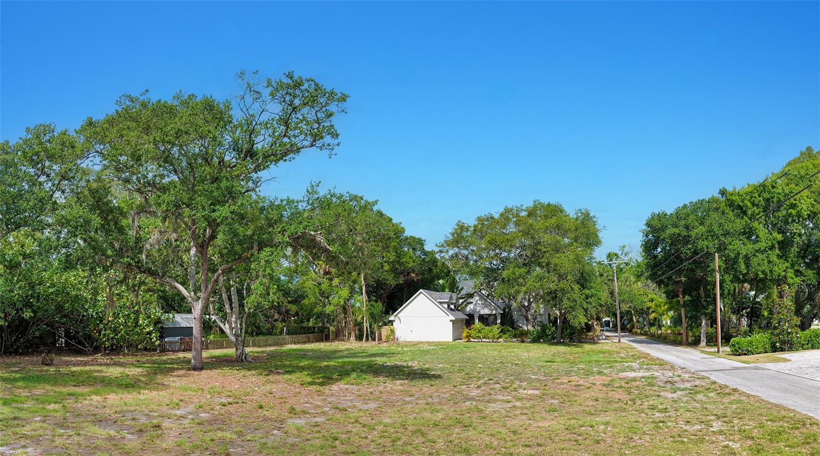 In the sought-after, historic neighborhood of Indian Beach, this large corner lot offers a canvas to design and build your dream home. Spanning nearly 16,000 square feet (0.37 acres), this generous parcel provides the scale and flexibility that is increasingly more difficult to find in the area. The lot has been cleared of dead trees, underbrush and debris, thereby being ready for your architectural vision. Minutes to the airport, Ringling Museum, Asolo and multiple cultural and dining options that downtown Sarasota has to offer. Bring your architect, bring your builder and claim your piece of paradise today.