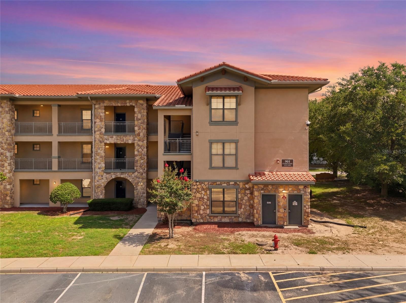 Enjoy carefree resort-style living in this beautifully maintained ground-floor unit! This move-in-ready home features granite countertops, tile flooring throughout, ceiling fans, and all appliances included for your convenience complete with three en suites and a split floorplan. 
The private location offers no rear neighbors, creating a peaceful setting to relax and unwind. The HOA handles exterior maintenance and also includes cable and Wi-Fi, making ownership simple and stress-free.
Residents enjoy an impressive array of community amenities, including a sparkling pool, spa, fitness center, kiddie pool, game room, and media room—everything you need for recreation and entertainment just steps from your door.
Adding even more value, the building's roof was recently replaced, providing added peace of mind. Short term and long term approved, this property offers exceptional flexibility whether you're seeking a primary residence, vacation getaway, or investment opportunity.
Don't miss this opportunity to own a low-maintenance home with outstanding amenities and a convenient ground-floor location near all that Central Florida has to offer. Walking distance to Barry town Center, bars, restaurants and more