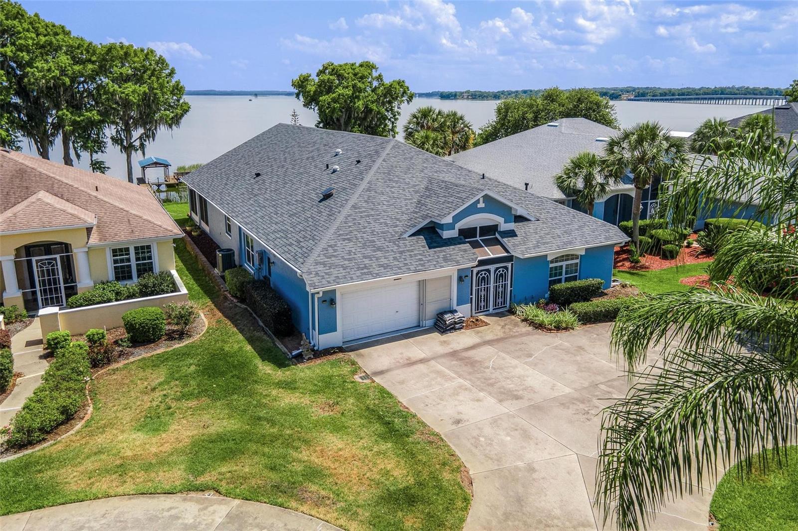 Experience the ultimate Florida lifestyle with this exceptional WATERFRONT HOME on the renowned Lake Harris CHAIN OF LAKES. Offering over 3,300 sq feet of living space, this spacious residence features four bedrooms, three baths and breathtaking views of LITTLE LAKE HARRIS. RECENT UPDATES INCLUDE A NEW ROOF IN 2024, NEW HVAC IN 2022, AND NEW INSTANT HOT WATER HEATER for added peace of mind. The expansive 33' x 12' FLORIDA ROOM PROVIDES THE PERFECT SETTING TO RELAX AND ENJOY PICTURESQUE WATERFRONT AND SUNSETS YEAR ROUND.  Located in the highly sought after Royal Harbor gated community, residents enjoy resort-style amenities. including a waterfront dock and fishing pier, RV and boat storage, the Lighthouse Recreation Center, scenic nature trails and bike pathS, tennis courts, pickleball, bocce ball, and a heated lakeside POOL AND SPA with screened enclosure.  This vibrant and active community offers the perfect blend of relaxation, and waterfront living--TRULY THE BEST YEARS OF YOUR LIFE AWAIT. COME AND LIVE THE FLORIDA LIFESTYLE.      SELLER CAN NIT CLOSE UNTIL AFTER JULY 1.