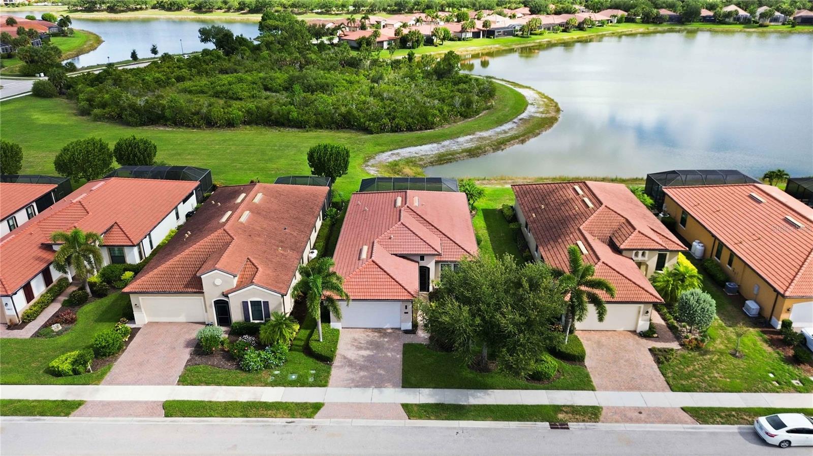 Beautifully maintained WCI-built pool home, offered turnkey furnished, ideally situated on a private cul-de-sac in the Lake Village of Sarasota National with peaceful water and preserve views. This 3-bedroom, 2-bath residence offers soaring ceilings in the foyer, neutral porcelain tile throughout the main living areas, and carpet in the two guest bedrooms only. Interior upgrades include tray ceilings, crown molding, and custom wood wall details that add warmth and character.

The open-concept kitchen and living room are designed for both everyday comfort and easy entertaining. The kitchen features solid maple cabinetry with dovetail construction and soft-close doors, granite countertops, a timeless backsplash, stainless steel appliances, and a breakfast bar with stone detail. A spacious dining room offers flexibility and could also serve as a home office or den.

The large primary suite is filled with natural light from oversized windows that perfectly frame the serene water and preserve views. The en-suite bath offers dual vanities, a deep soaking tub, walk-in shower, and a large walk-in closet. Additional features include a spacious laundry room with upper cabinets and utility sink, a water softener, AC system 2024 and a Generac generator for added peace of mind

Outdoor living is truly exceptional, with an extended custom lanai, Storm Smart lanai shutters, and a screened pool and spa overlooking the preserve and water. This home also offers the convenience of no exterior grounds maintenance, as it is included in the HOA. Best of all, no golf fees or golf membership are required.

Located in Sarasota National, an Audubon International Certified Signature Sanctuary spanning more than 1,300 acres of preserved wetlands, wildlife, and natural beauty, residents enjoy resort-style amenities including the Palm Club Restaurant and Lounge, Tiki Bar with poolside food and beverage service, heated resort-style pool with lap lanes, zero-entry access and hot tub, spa, pickleball, tennis and bocce courts, 7,000-square-foot fitness center with scheduled classes, dog park, playground, coffee lounge, library/card room, and a full calendar of social events. Ideally located near Gulf Coast beaches, Historic Downtown Venice, and the vibrant Wellen Park area, this is more than a home—it’s a lifestyle.
