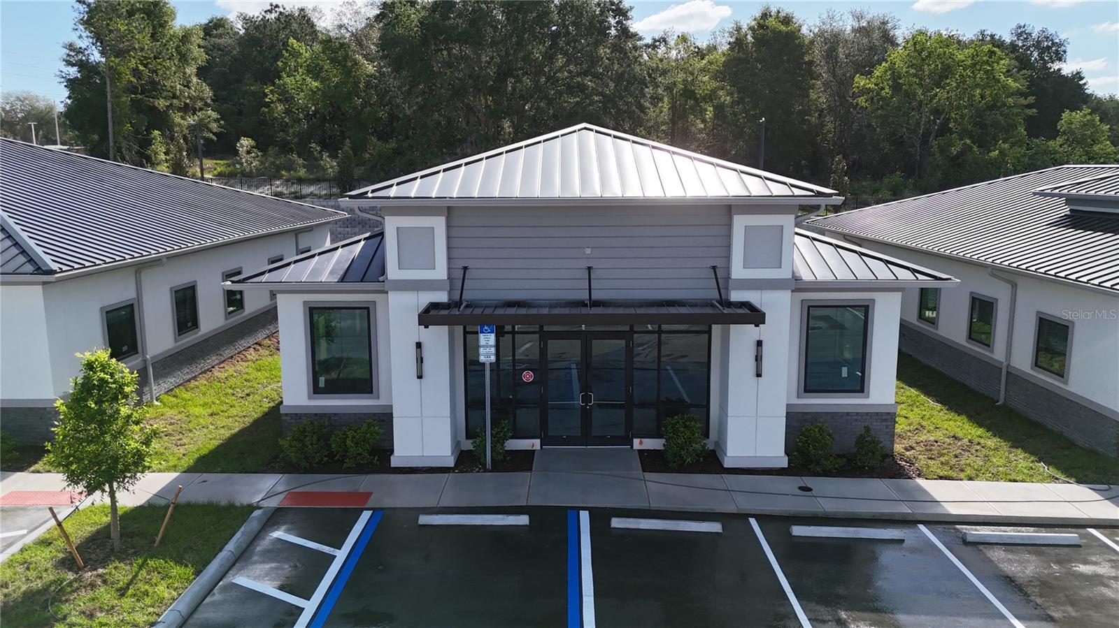 Building #07 is available for purchase at Lake Carter Exchange, a distinguished mixed-use development in Apopka’s East Shore at the intersection of Ocoee-Apopka Road and W Keene Road. This dark gray shell building is ideal for medical or professional offices, with potential for retail use based on buyer needs. The shell delivery offers full flexibility for custom interior design. The development is strategically located less than one mile from Advent Health’s seven-story, 120-bed hospital and opposite a new Publix Supermarket development. Situated in the vibrant East Shore trade area, which includes 5,000 planned residences and an average household income above $100k, this Class A property is perfectly positioned for businesses targeting growth in Central Florida’s second-fastest-growing city. Contact us for pricing details/incentives and to schedule a tour of this exceptional commercial opportunity.